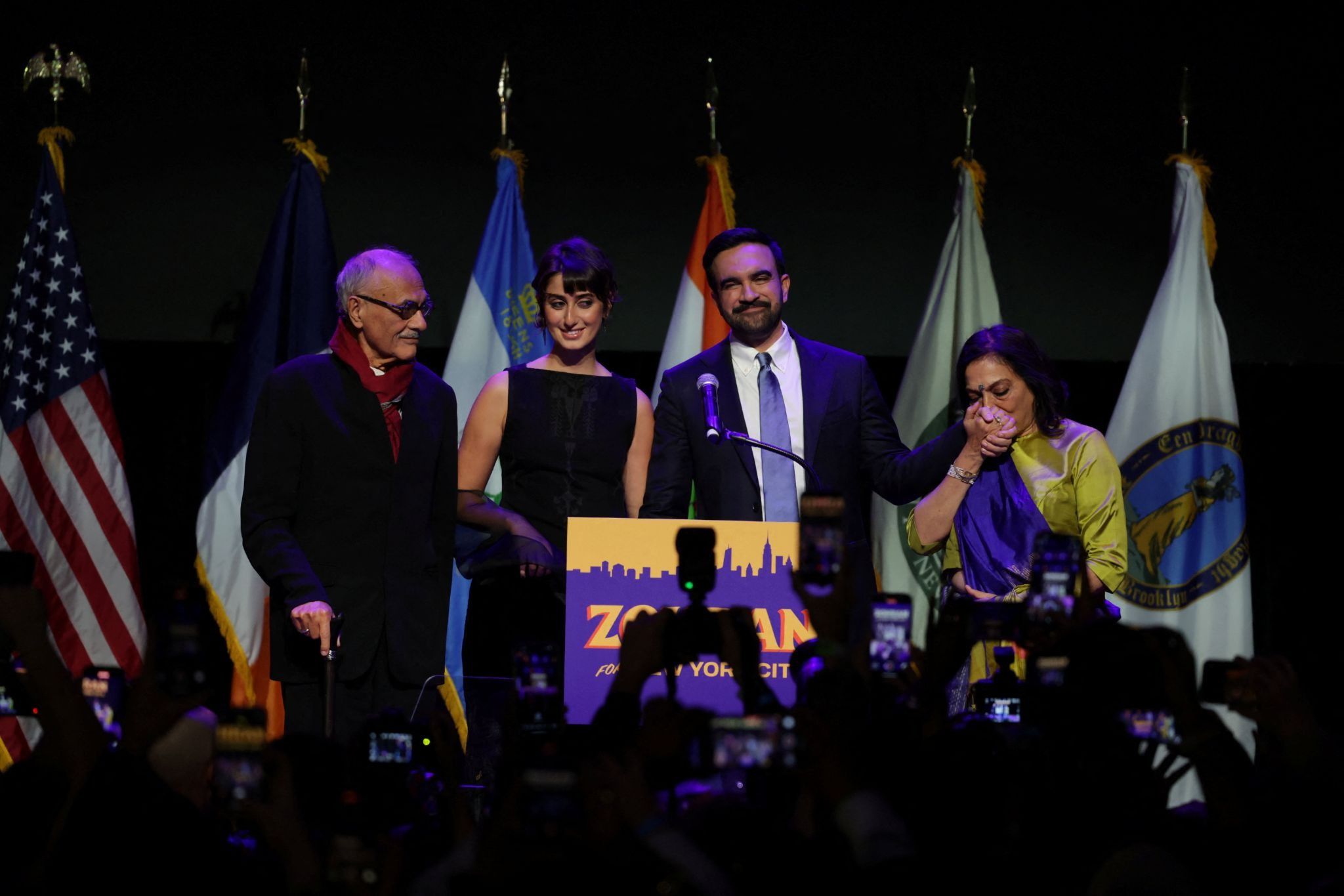 Mayor-elect Zohran Mamdani and family on stage.