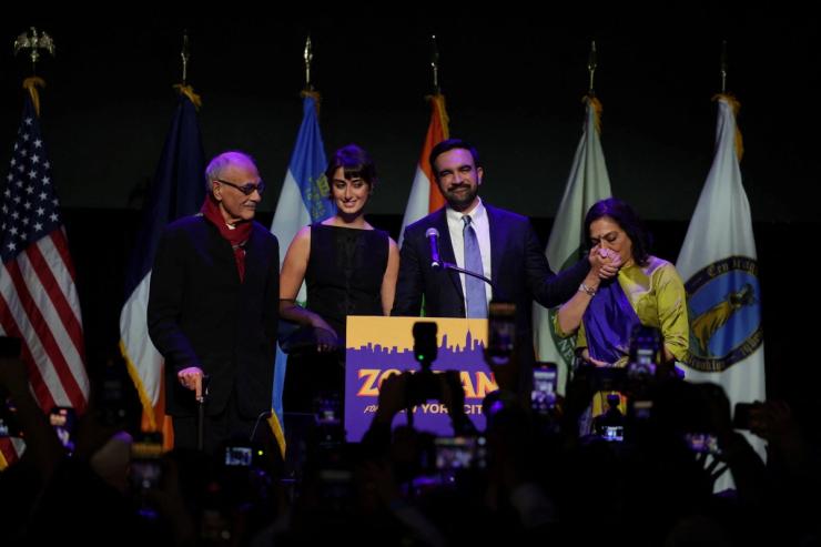 Mayor-elect Zohran Mamdani and family on stage.