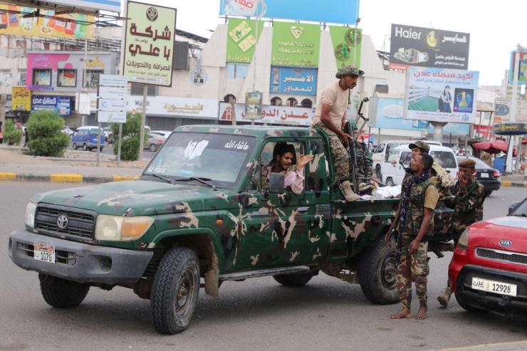 Police patrol Aden.