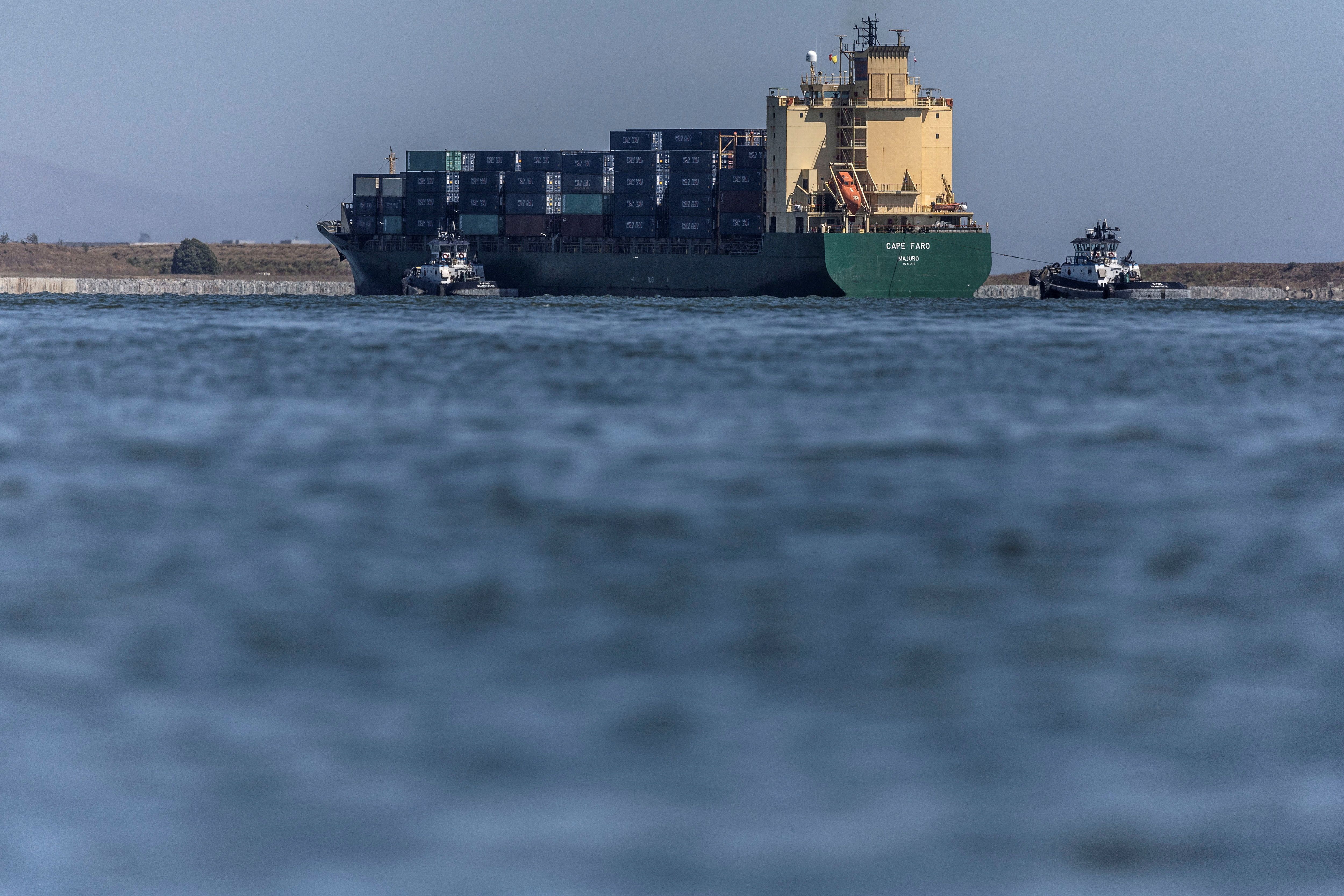A cargo ship arrives at the port of Oakland, California.