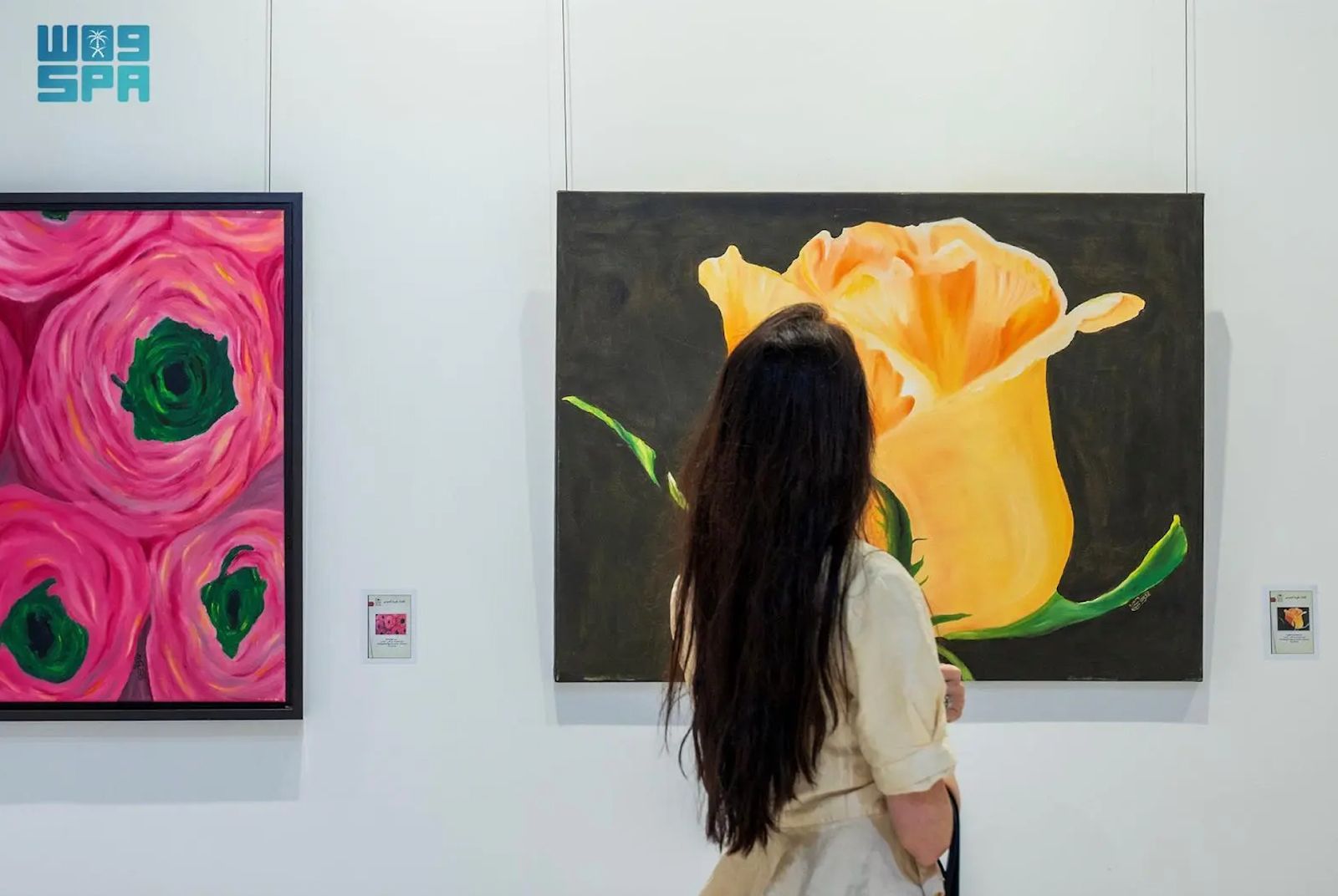 A woman visits a gallery during Riyadh Art Week.