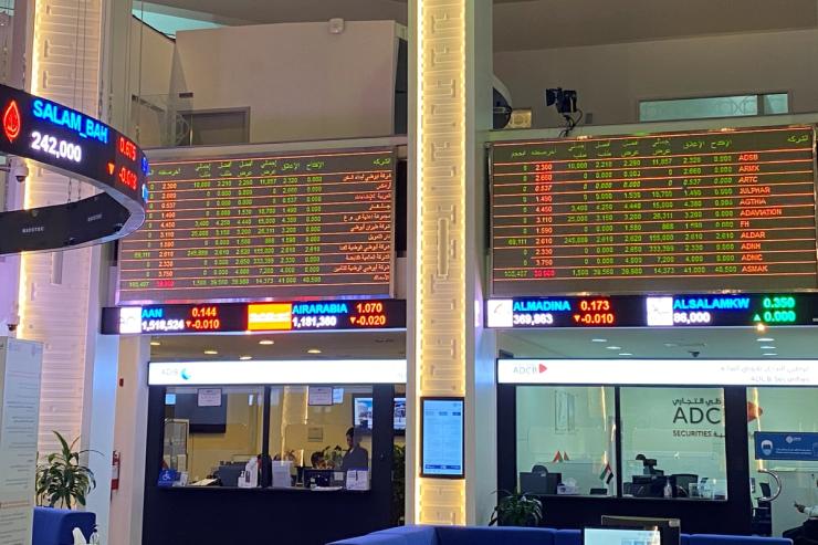 Electronic boards showing stock information are pictured at the stock market, in Dubai, United Arab Emirates.