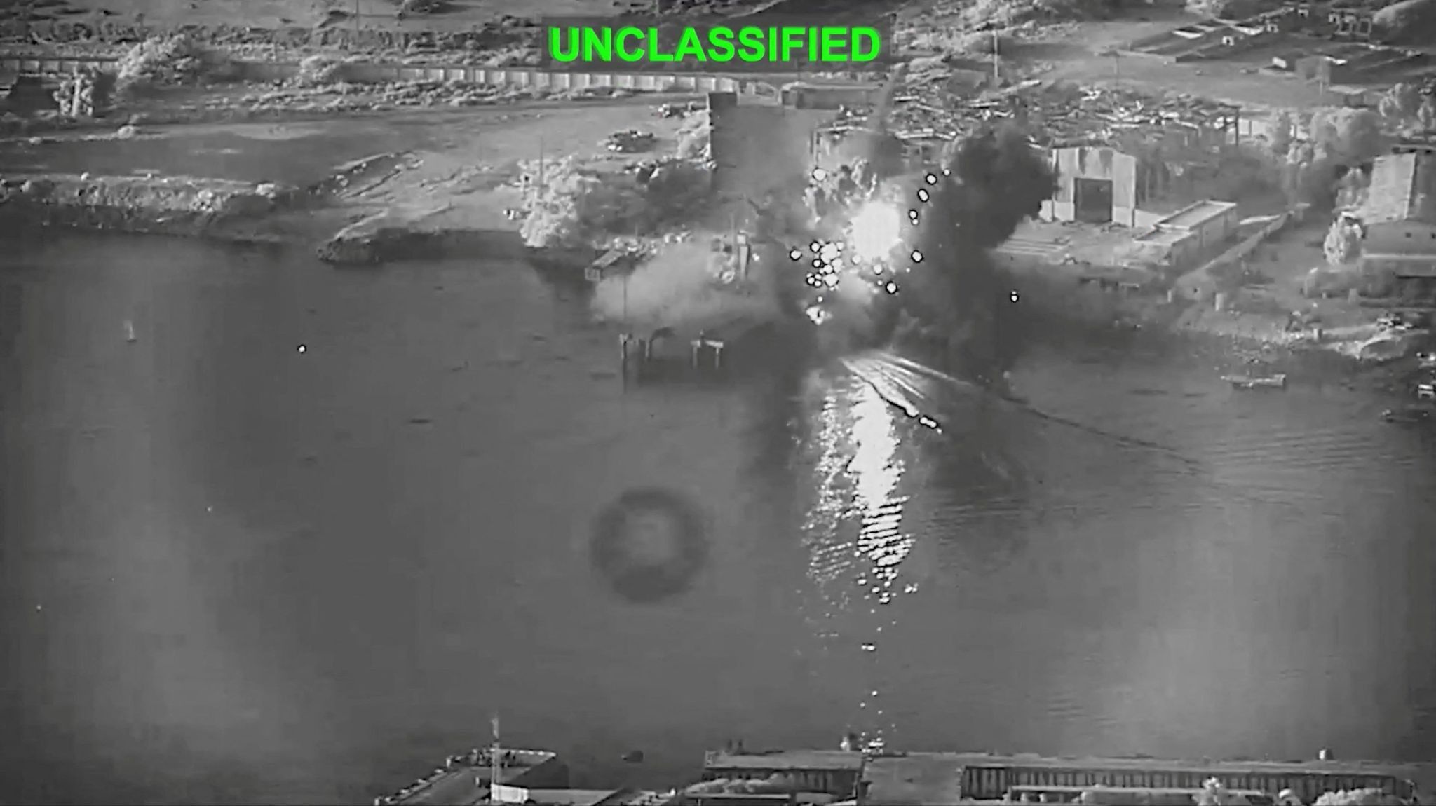 Smoke rises after a U.S. one-way attack surface drone reached its target, a submarine and ship maintenance facility. 