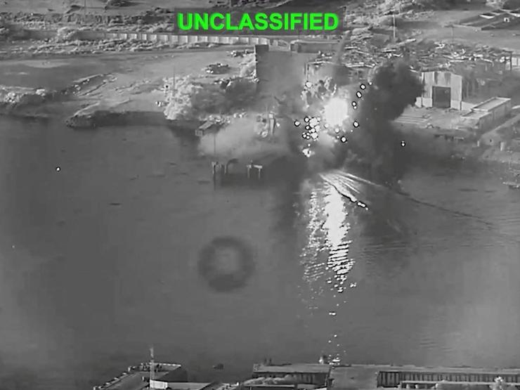 Smoke rises after a U.S. one-way attack surface drone reached its target, a submarine and ship maintenance facility.