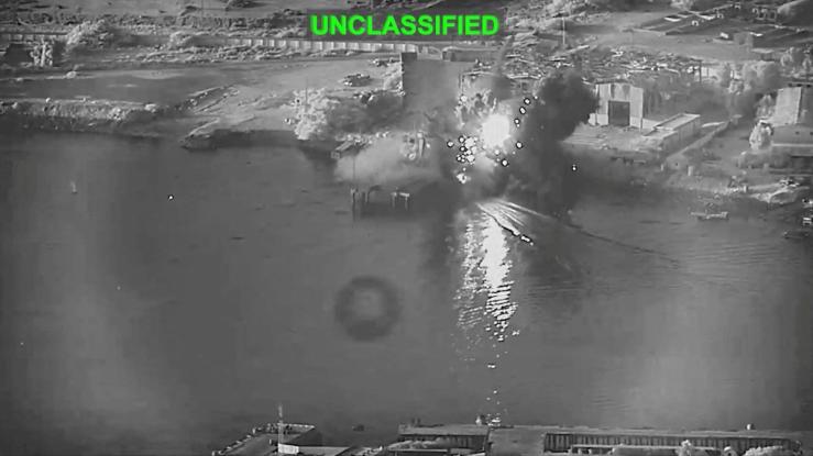 Smoke rises after a U.S. one-way attack surface drone reached its target, a submarine and ship maintenance facility.