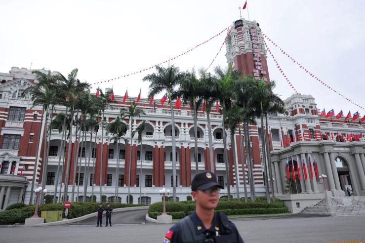 Security guards stand guard in front of the Presidential Office Building in Taipei.