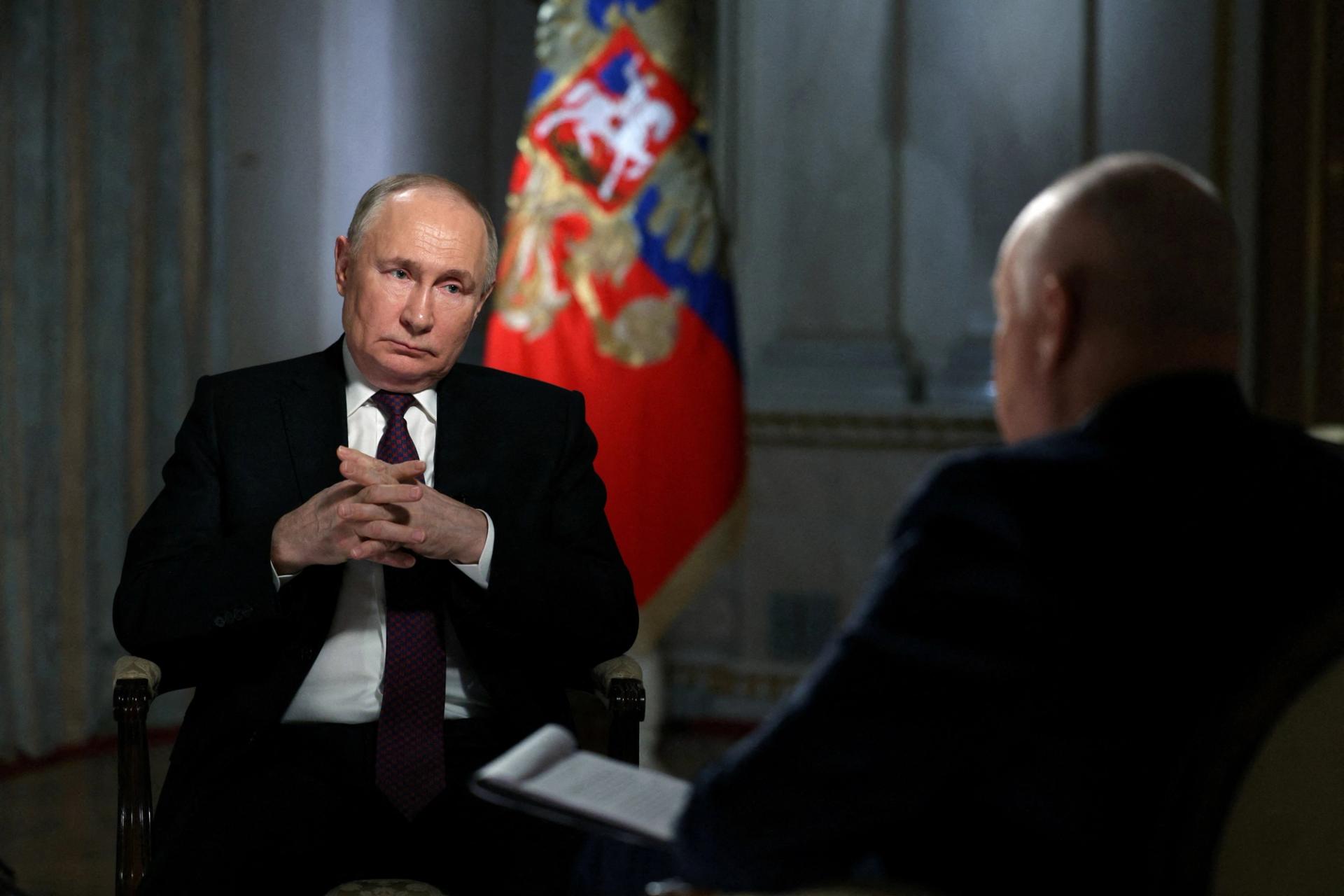 President Vladimir Putin speaks with Director General of Rossiya Segodnya media group Dmitry Kiselyov during an interview in Moscow, Russia, on March 12, 2024. 