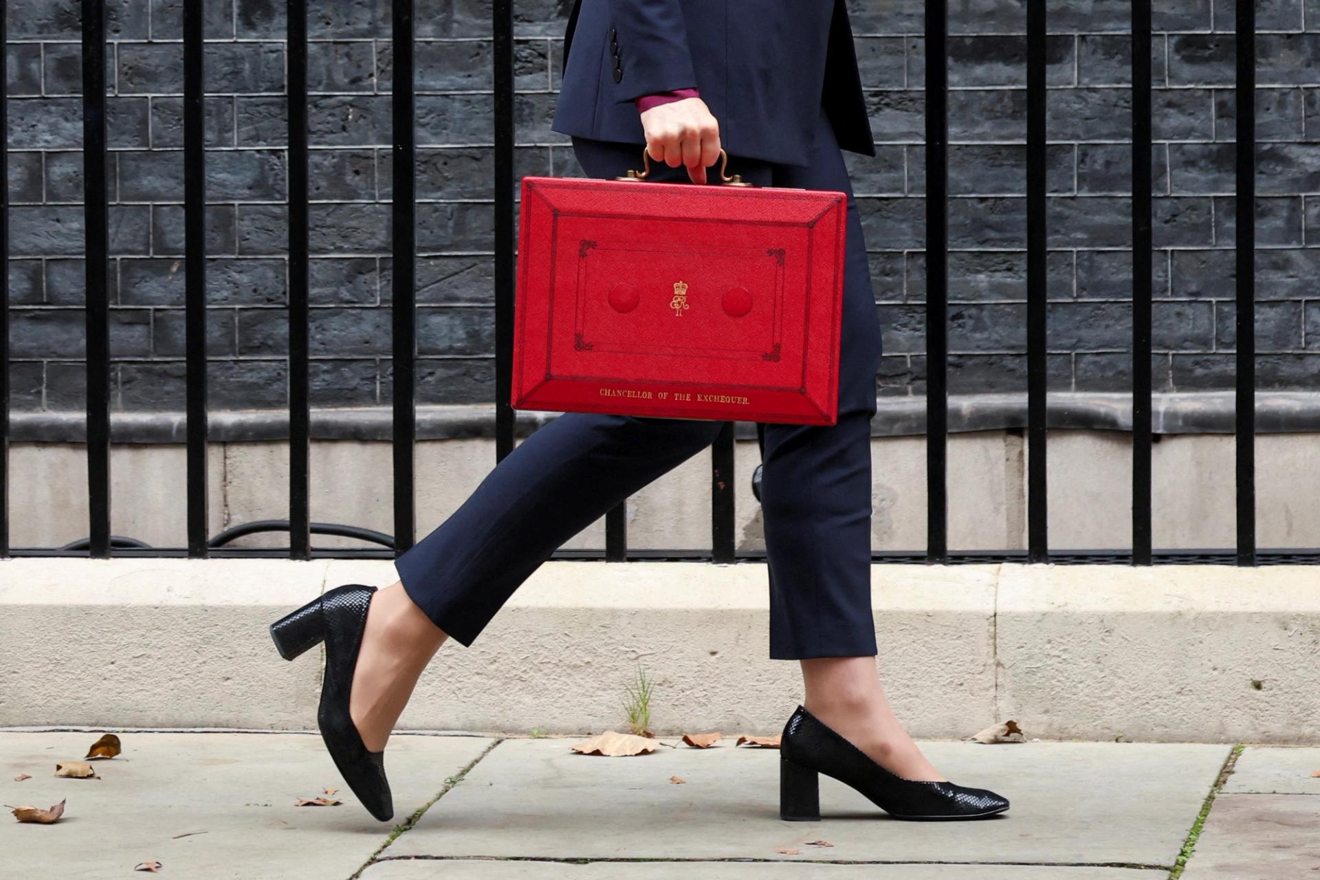 Chancellor Rachel Reeves carrying the red budget box, leaves Downing Street 