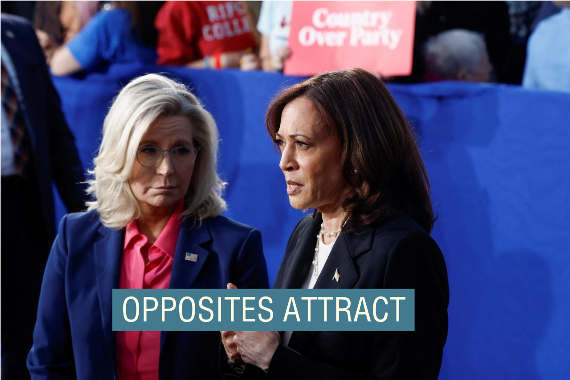 Kamala Harris and Liz Cheney, both wearing suits, standing together at a campaign event. 