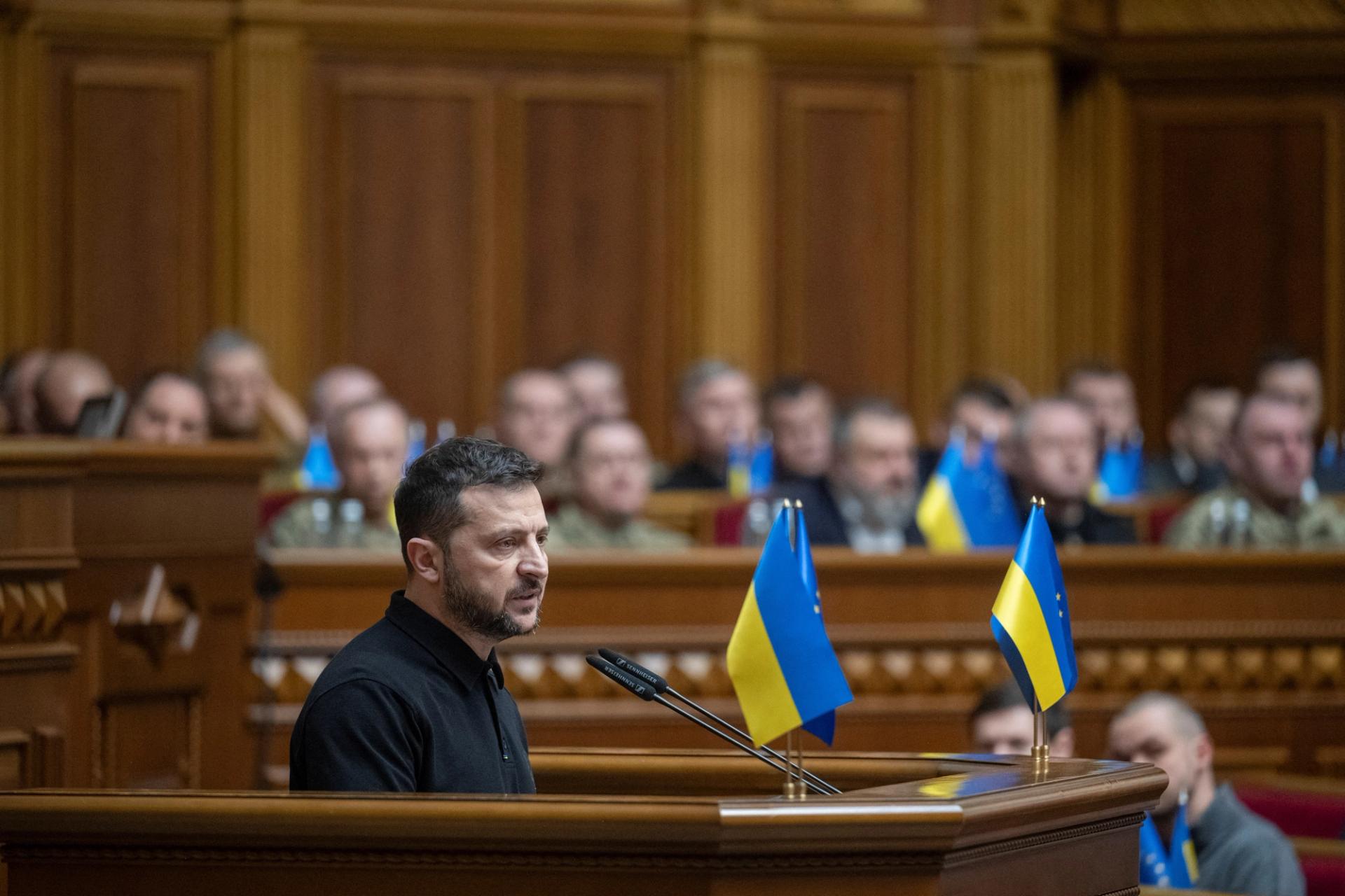 Volodymyr Zelenskyy, wearing a dark polo shirt, addresses Ukraine's Parliament.