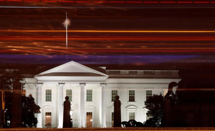 A view of the White House by night.