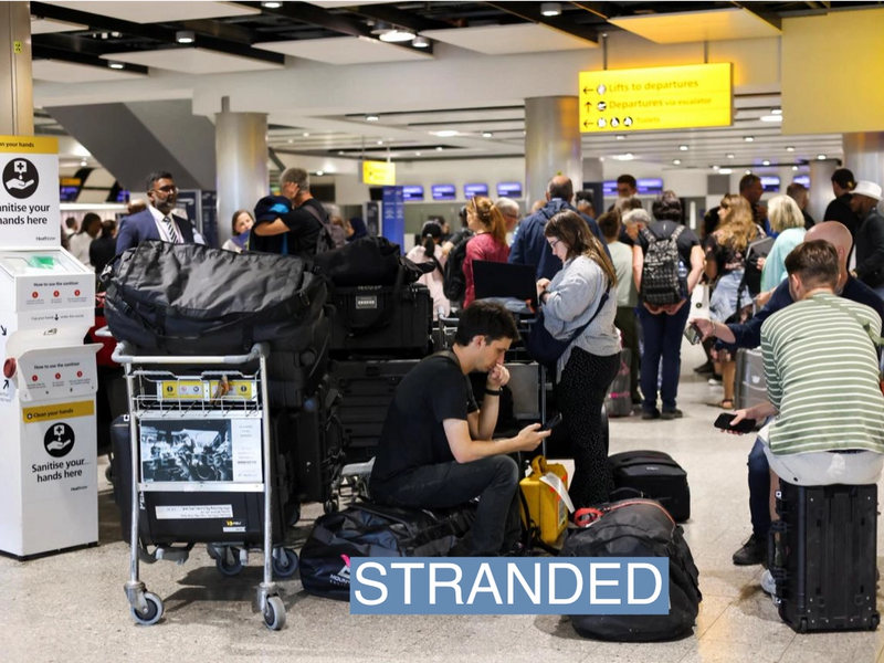 Travellers wait near the British Airways check-in area at Heathrow Airport, as Britain's National Air Traffic Service (NATS) restricts UK air traffic due to a technical issue causing delays, in London, Britain, August 28, 2023. REUTERS/Hollie Adams
