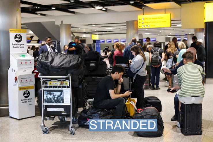 Travellers wait near the British Airways check-in area at Heathrow Airport, as Britain’s National Air Traffic Service (NATS) restricts UK air traffic due to a technical issue causing delays, in London, Britain, August 28, 2023. REUTERS/Hollie Adams