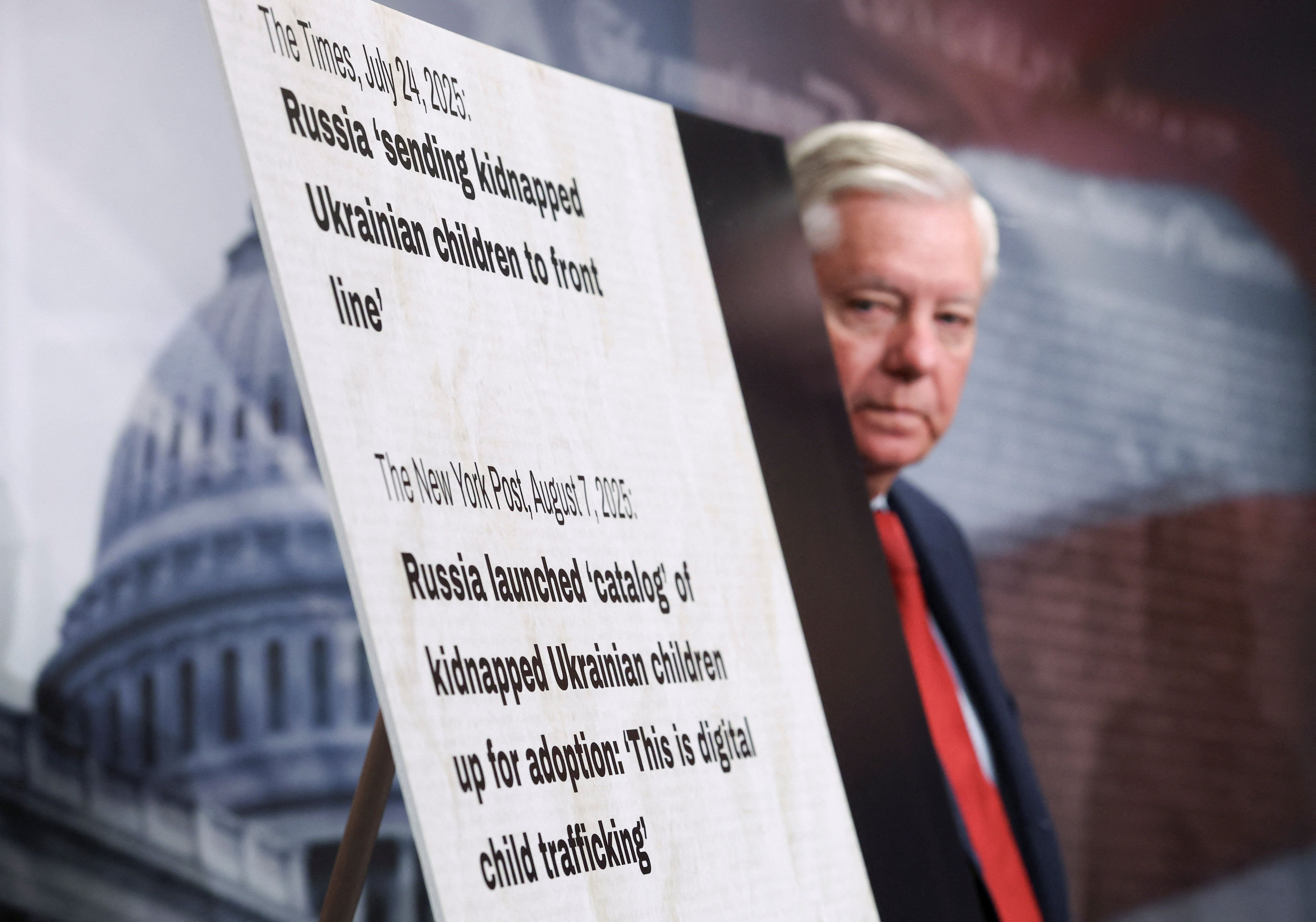 Sen. Lindsey Graham, R-S.C., takes part in a press conference announcing a bill to name Russia as a state sponsor of terrorism.