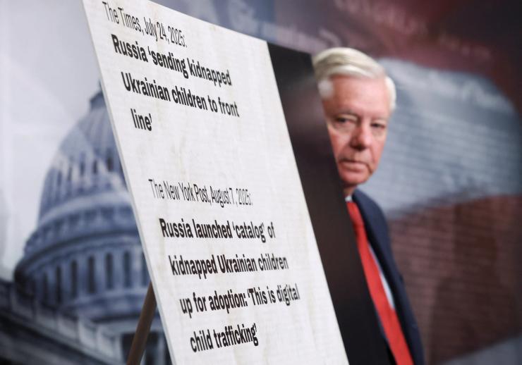 Sen. Lindsey Graham, R-S.C., takes part in a press conference announcing a bill to name Russia as a state sponsor of terrorism.
