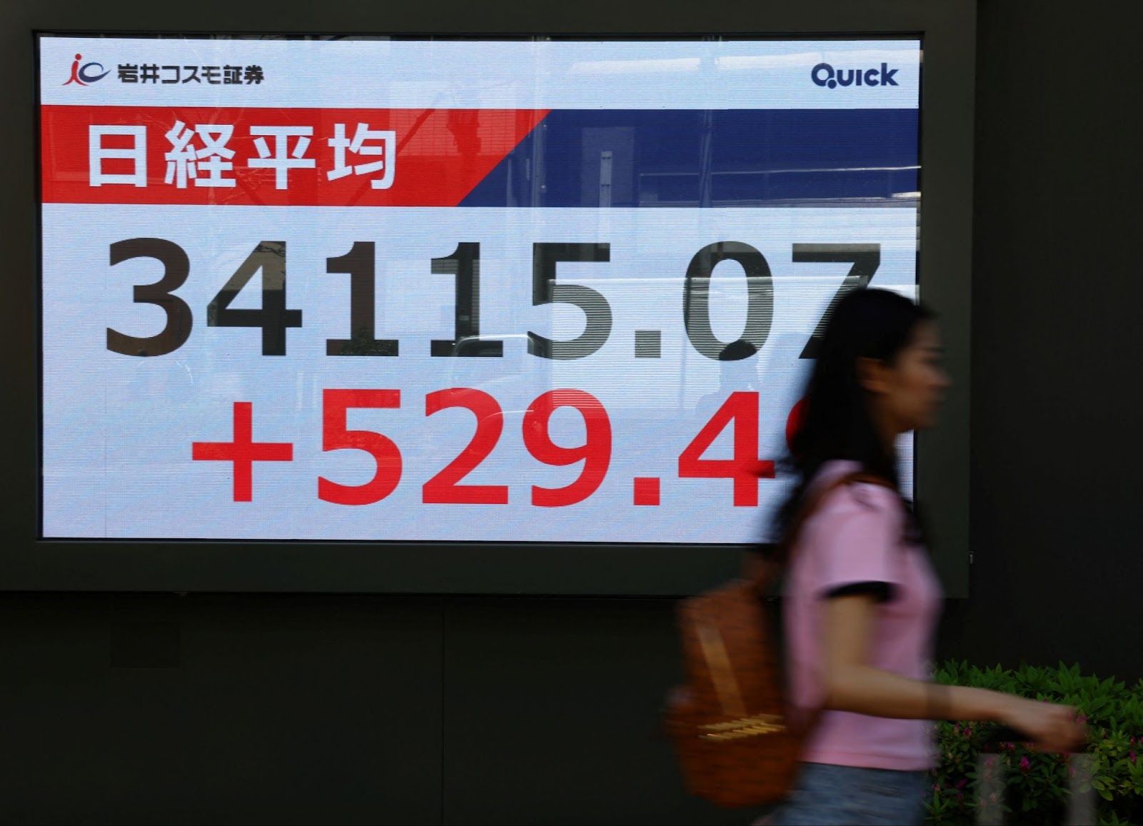 A photo showing a stock’s tracker rising