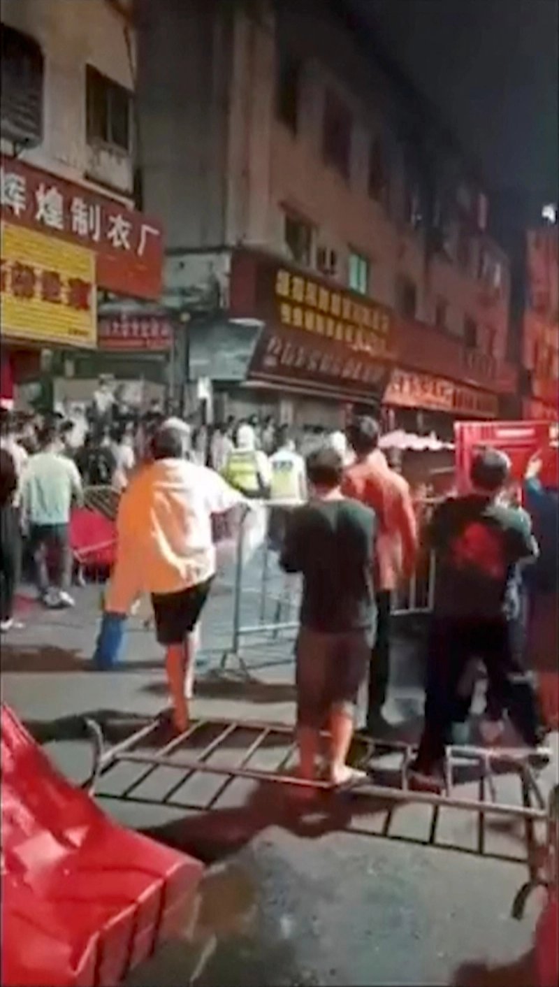 People protest in Guangzhou, China, in this still image obtained from a video released November 15, 2022