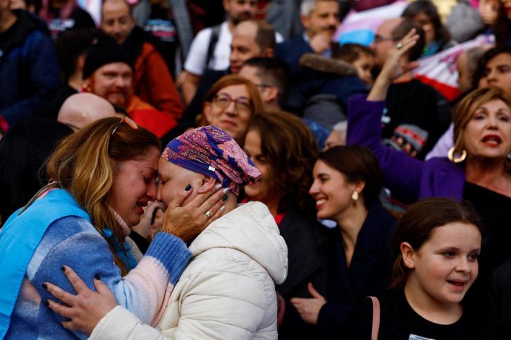 Activists celebrate transgender rights bill outside Spain’s Parliament in Madrid on Dec. 22