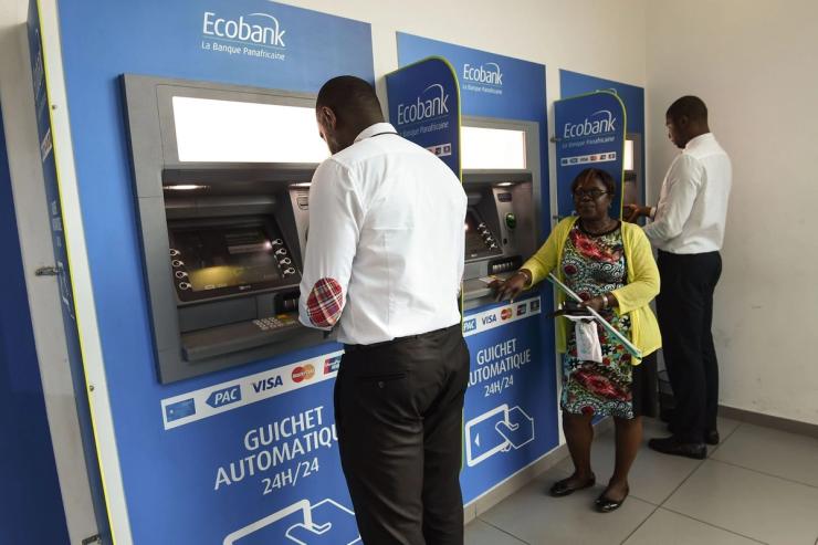 People use Ecobank Côte d’Ivoire cash dispensers in Abidjan.