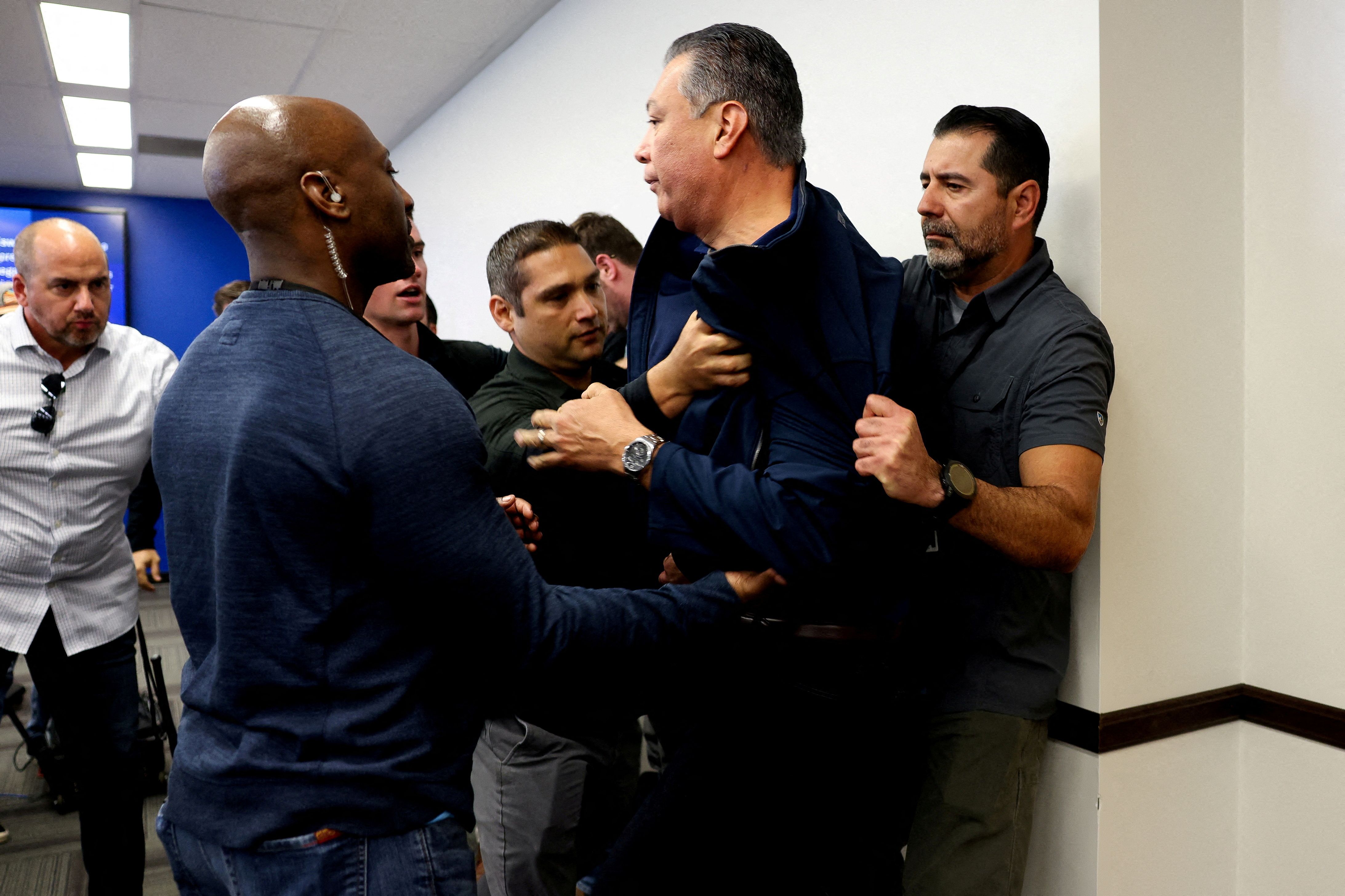 Sen. Alex Padilla, D-Calif., during his removal from the DHS event