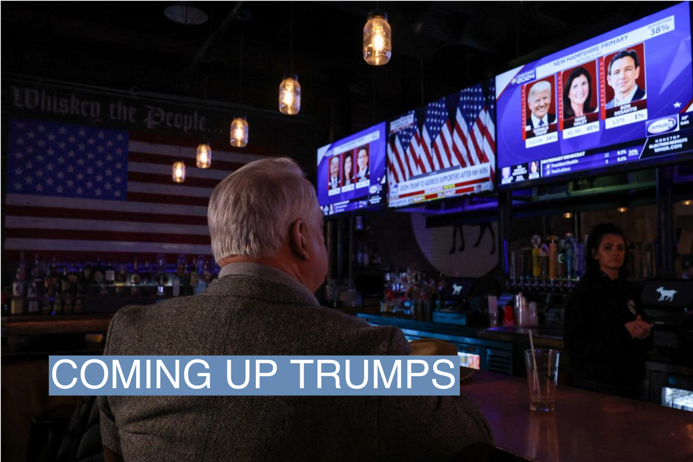 A man watches television as major news organisations project that Republican presidential candidate and former U.S. President Donald Trump wins during the New Hampshire presidential primary election, at The Goat in Manchester, New Hampshire, U.S., January 23, 2024. REUTERS/Reba Saldanha
