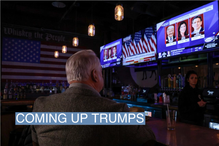 A man watches television as major news organisations project that Republican presidential candidate and former U.S. President Donald Trump wins during the New Hampshire presidential primary election, at The Goat in Manchester, New Hampshire, U.S., January 23, 2024. REUTERS/Reba Saldanha