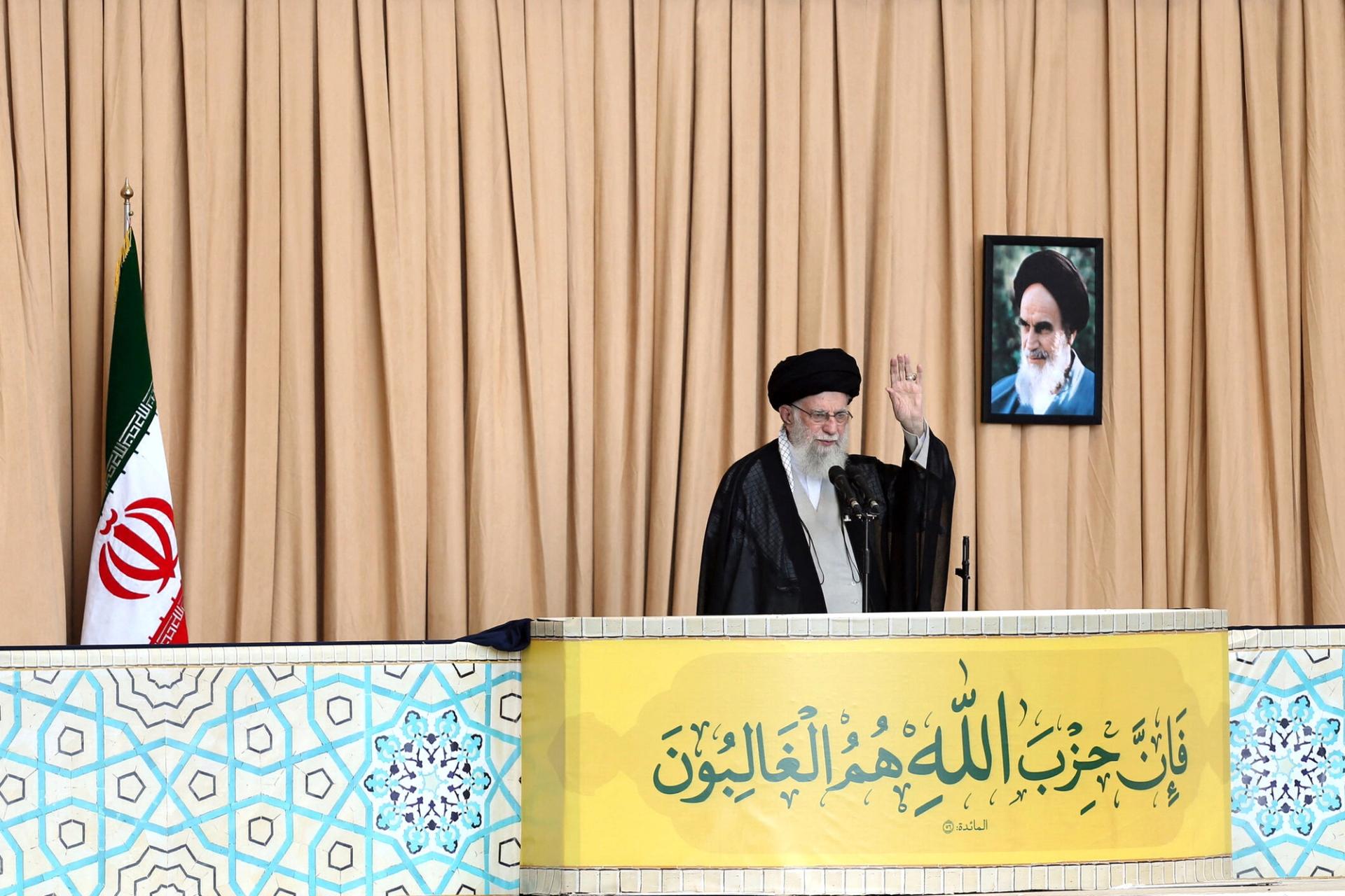 Iran’s Supreme Leader Ayatollah Ali Khamenei waves during the Friday Prayers in Iran, October 4.