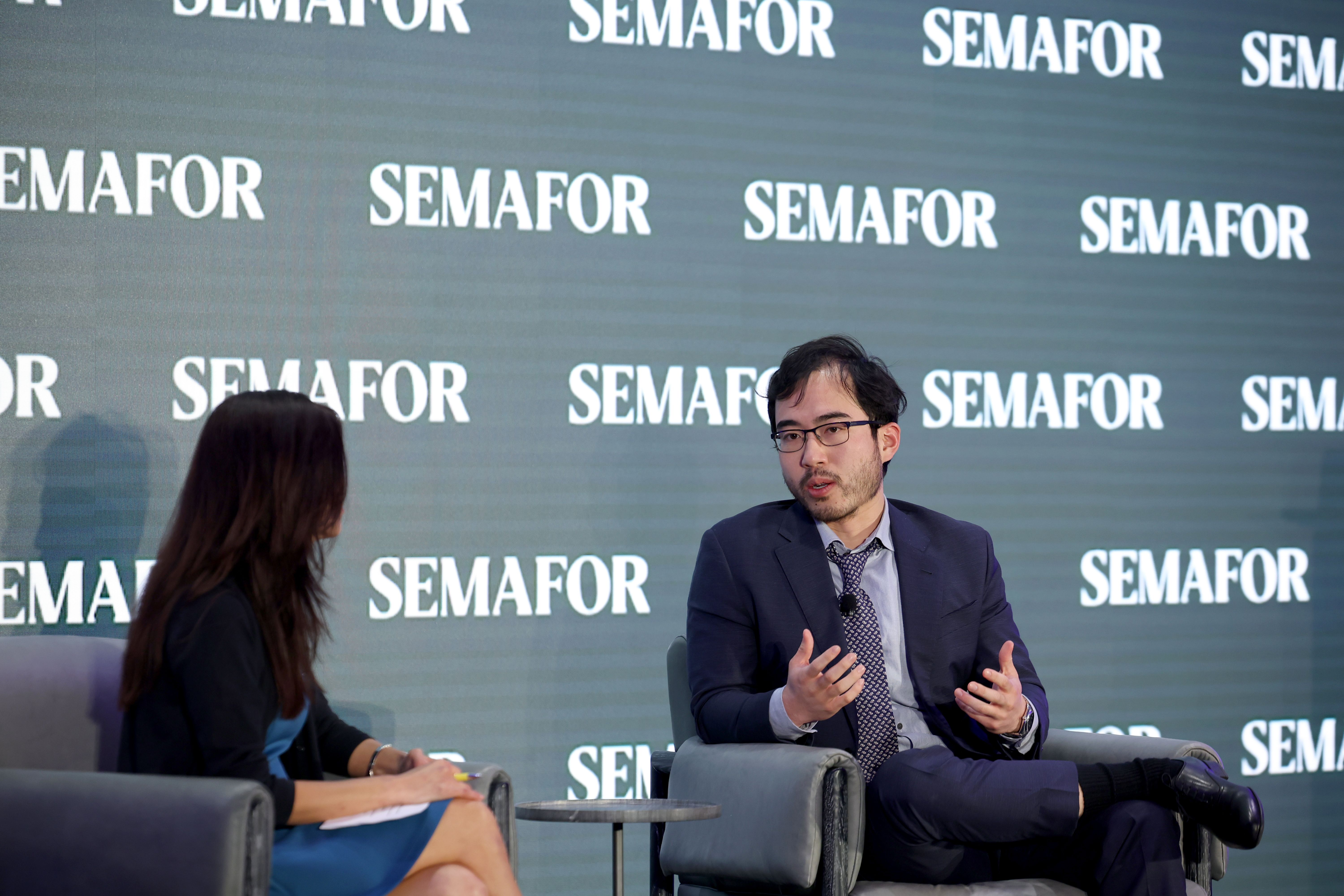 Kevin Guo speaking with Gina Chon in Washington DC.