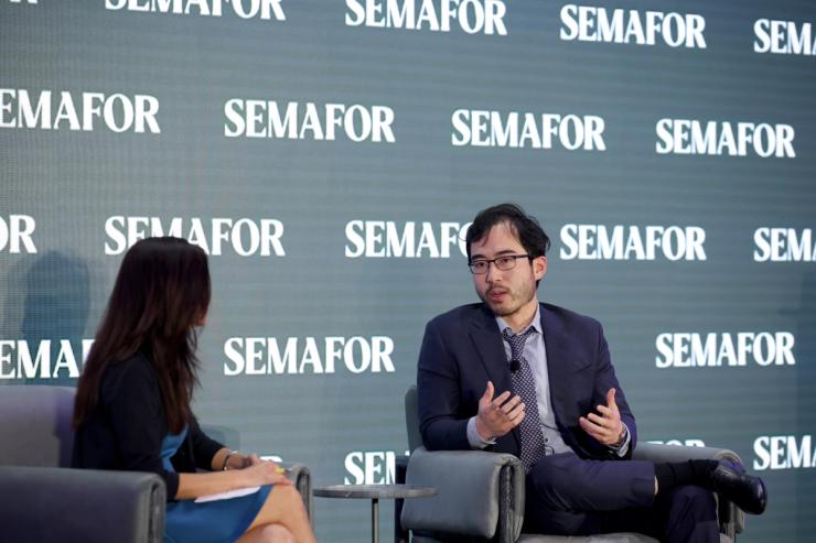 Kevin Guo speaking with Gina Chon in Washington DC.