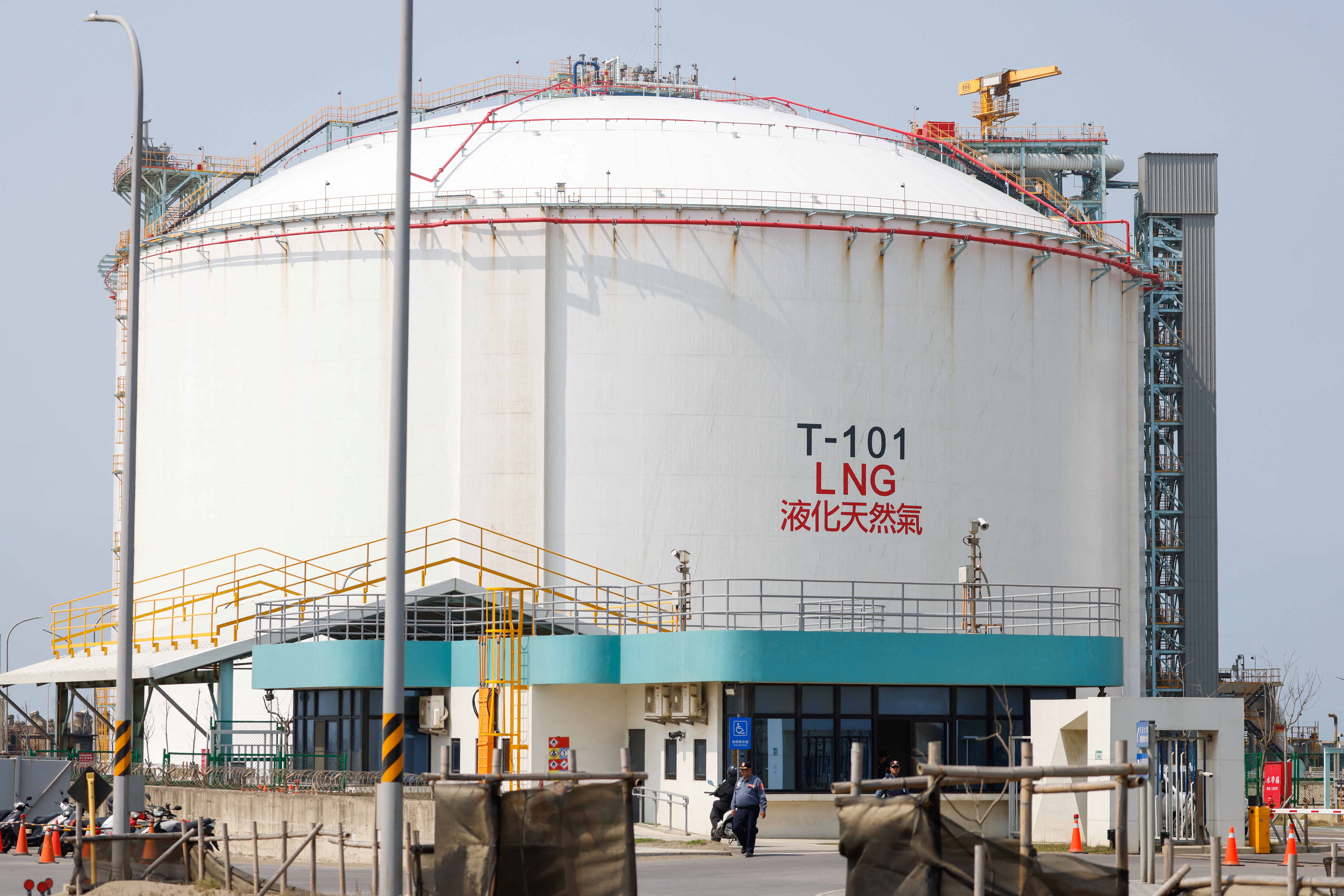 A security guard stands at the entrance of Guan-Tang LNG Receiving Terminal in Taiwan.