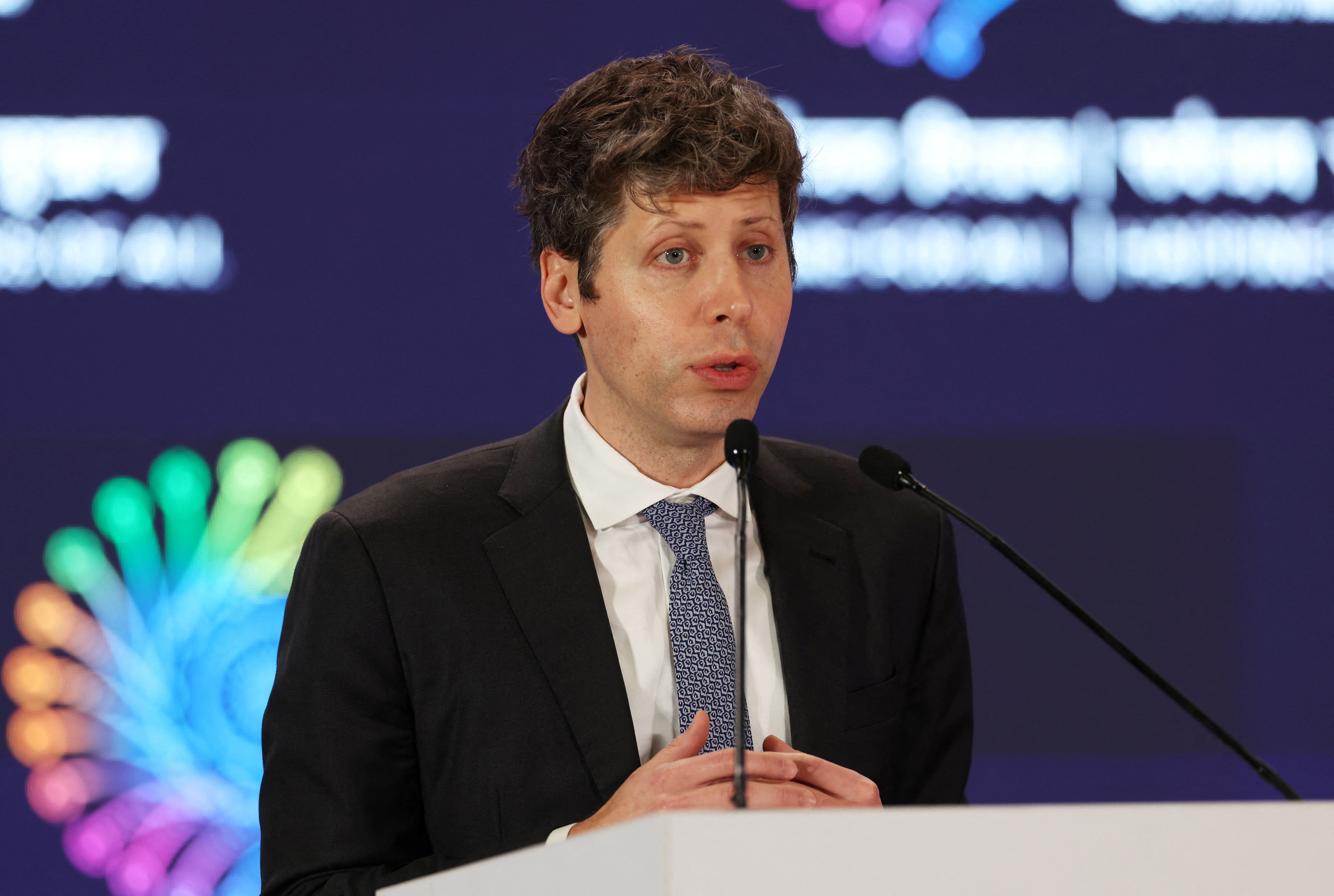 OpenAI CEO Sam Altman addresses the gathering at the AI Impact Summit, in New Delhi, India.
