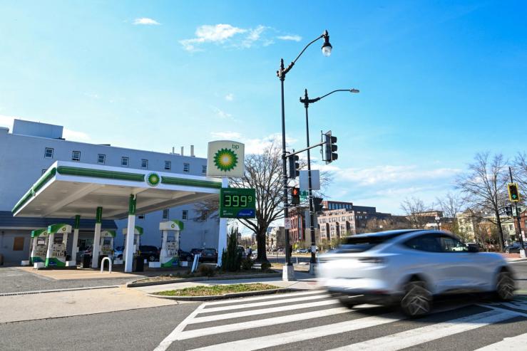 Cars pass a gas station in DC
