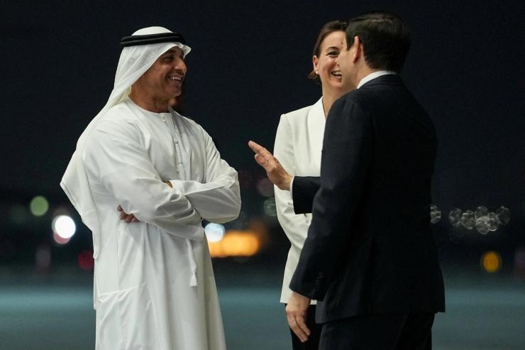 U.S. Secretary of State Marco Rubio speaks with UAE Ambassador to the U.S. Yousef Al Otaiba upon his arrival at Al Bateen Executive Airport.