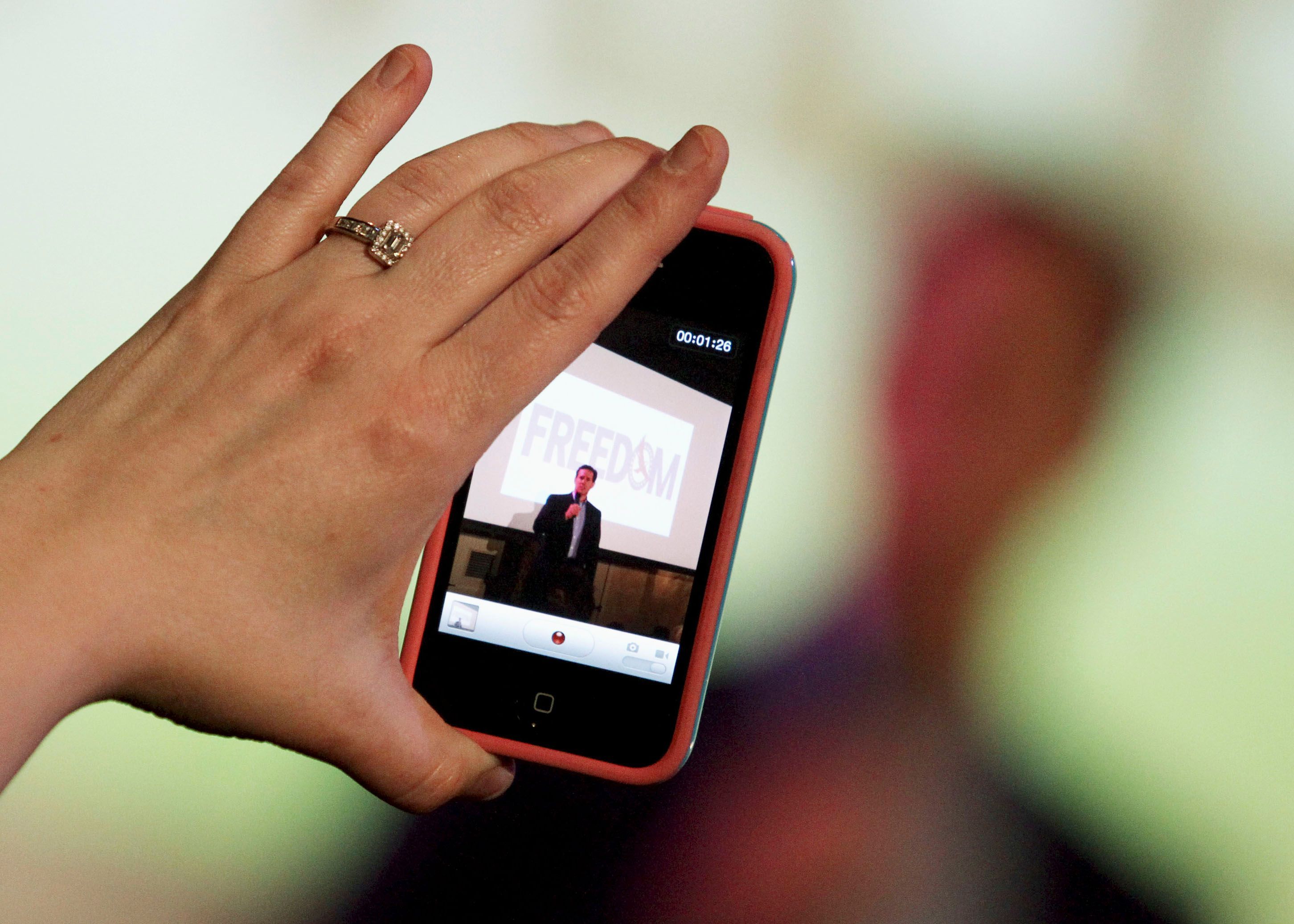 A woman films vertical video
