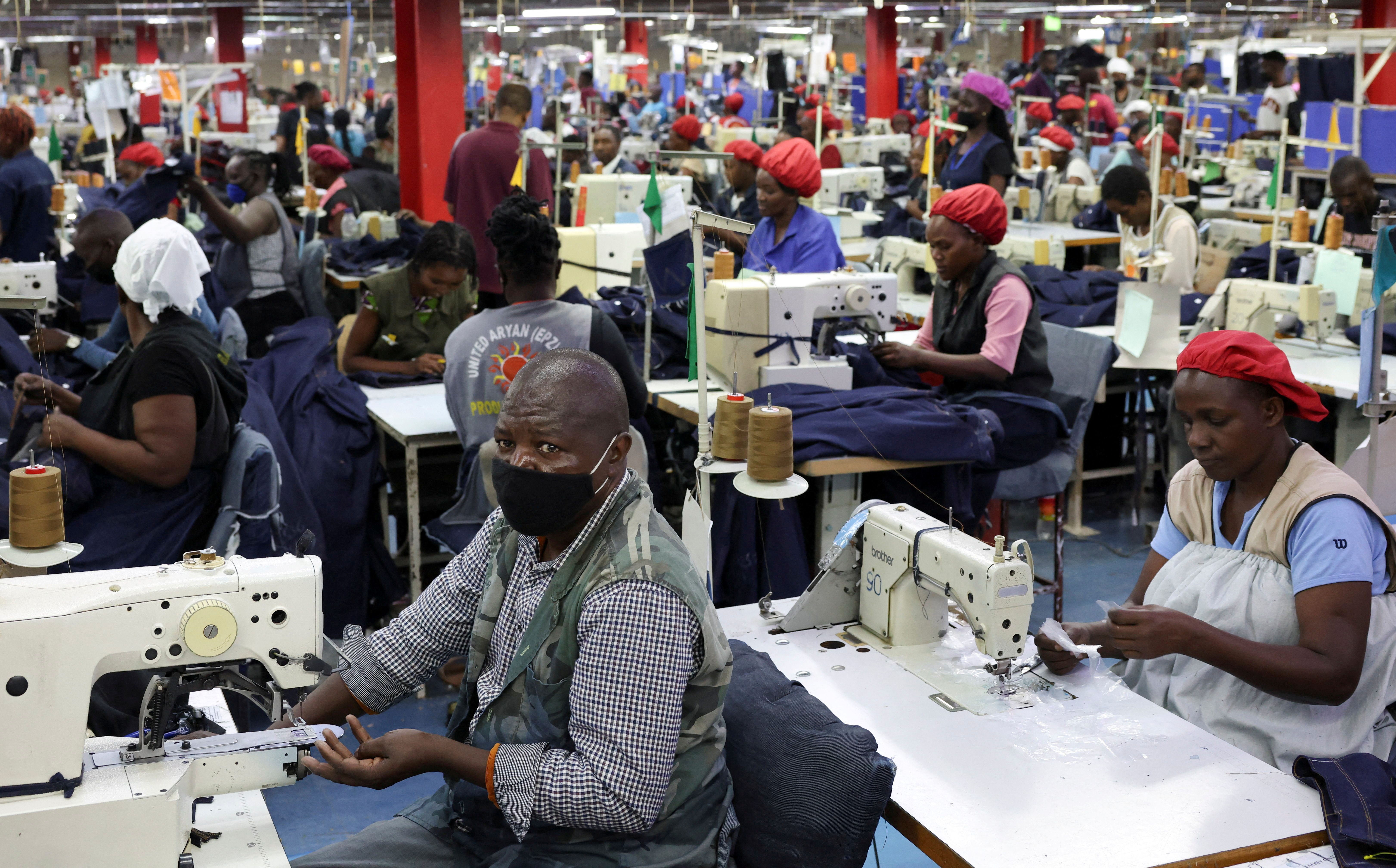 Kenyan workers prepare clothes for export at a factory operating under the AGOA agreement in Nairobi on April 9, 2025. 