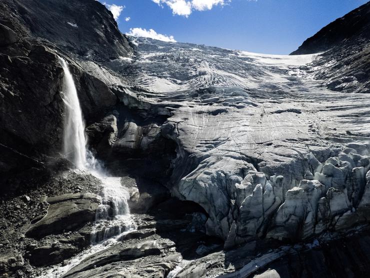 Water from melting ice running down the side of the Turtmann glacier in Switzerland.