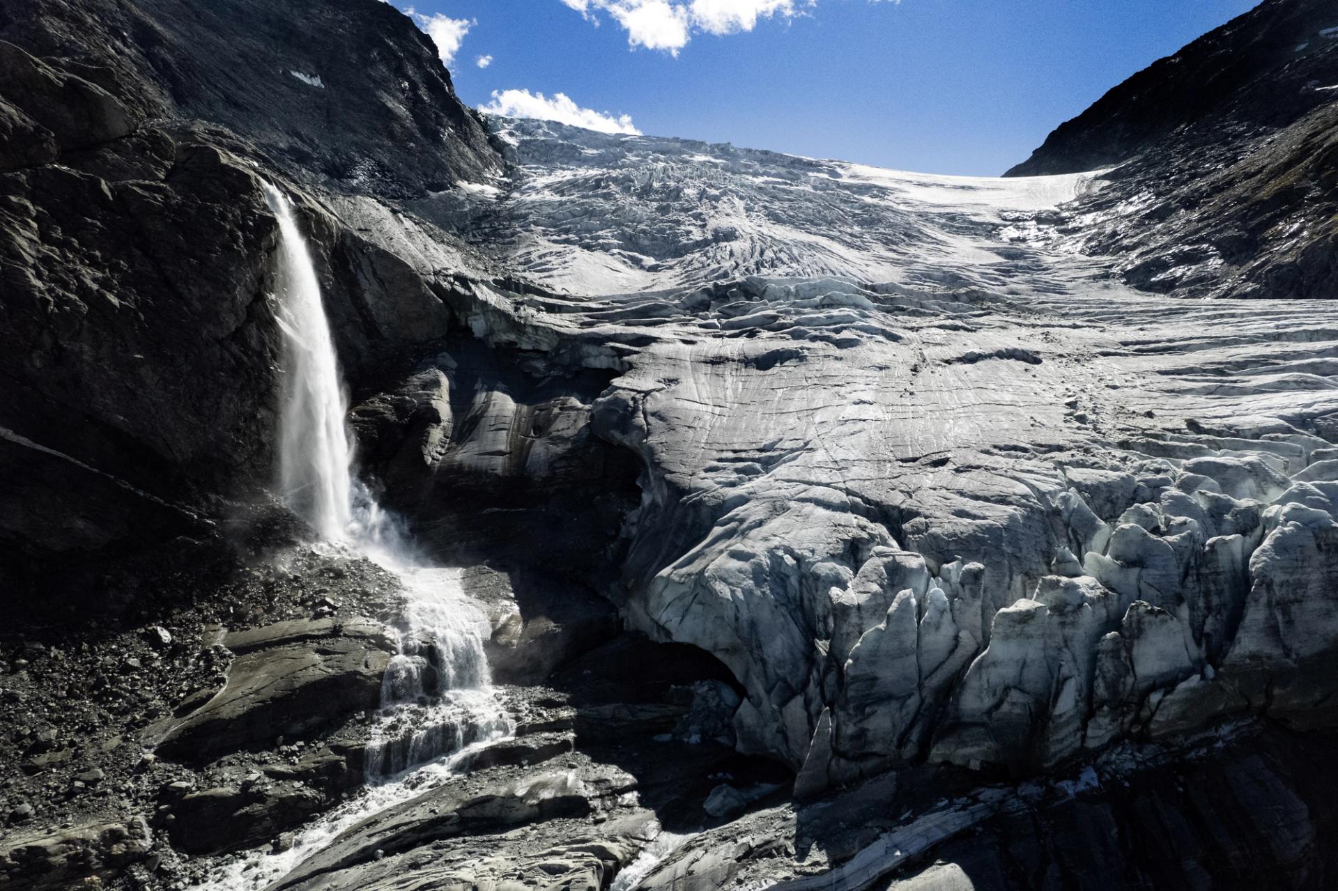 Water from melting ice running down the side of the Turtmann glacier in Switzerland.