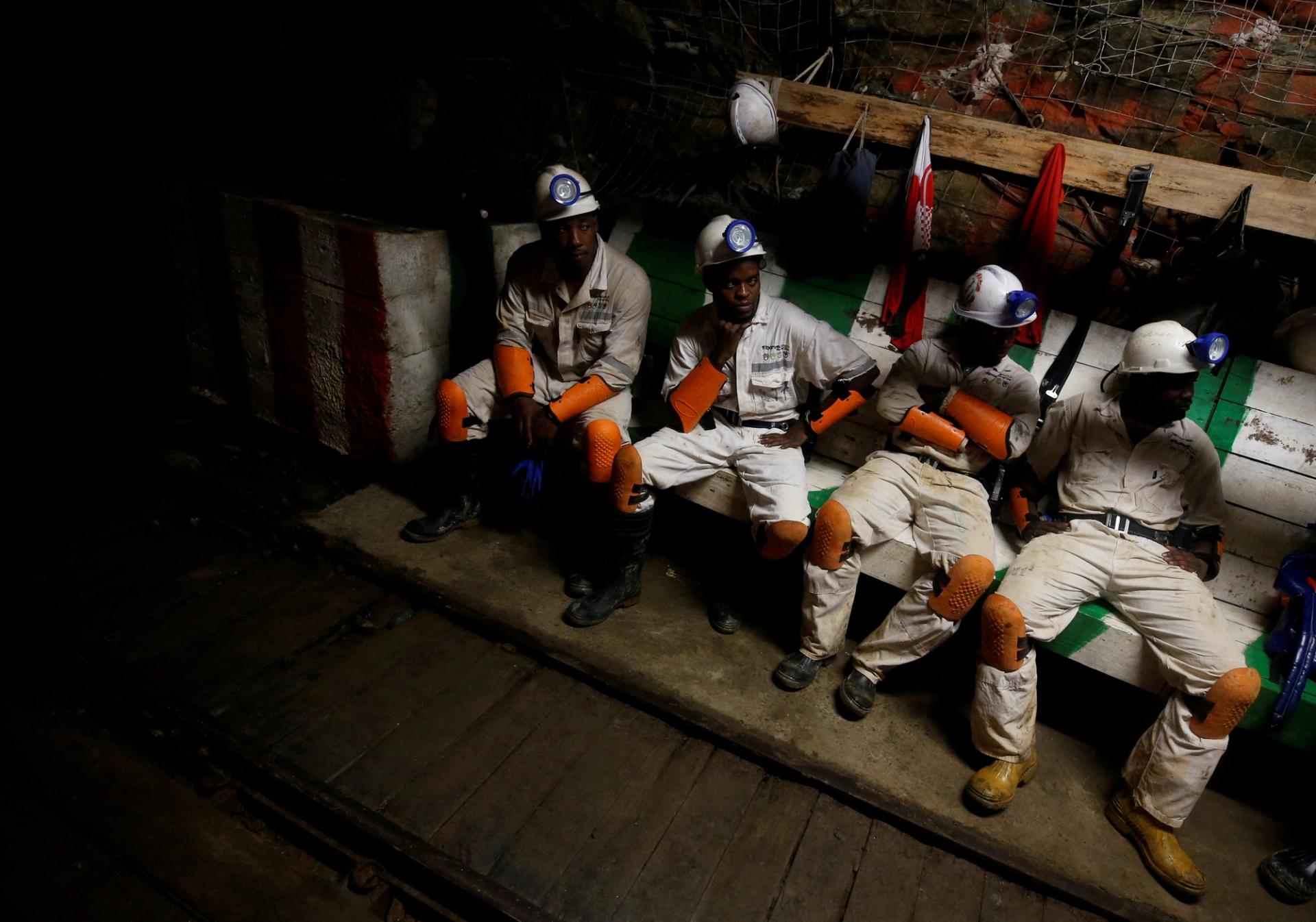 Gold miners take a break in Westonaria, South Africa.
