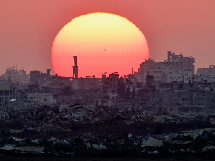 The sun sets over Gaza, as seen from the Israeli side of the border