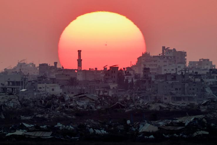 The sun sets over Gaza, as seen from the Israeli side of the border