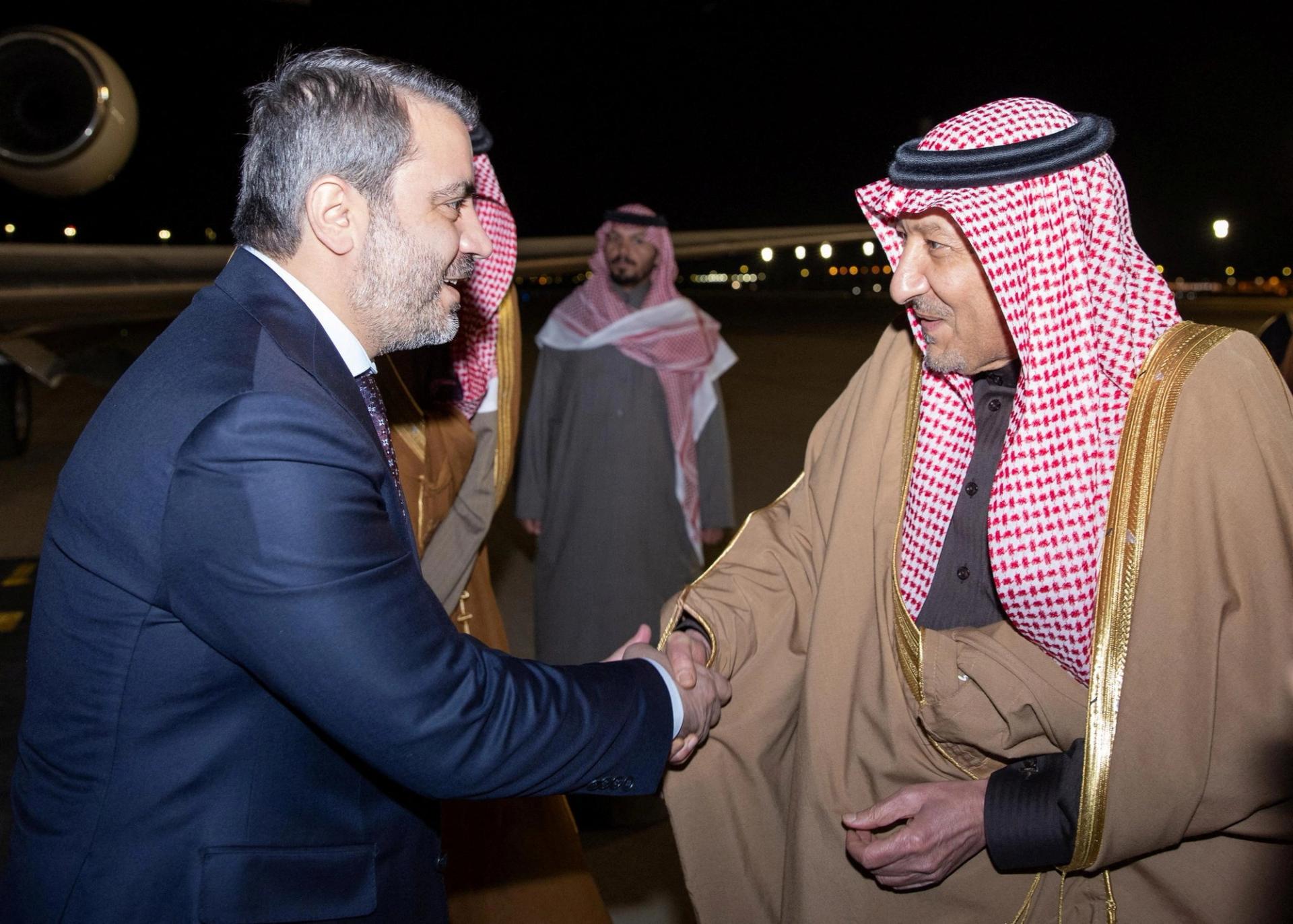 Syria’s newly appointed Foreign Minister Asaad Hassan al-Shibani and Saudi Deputy Foreign Minister Waleed Elkhereiji shake hands in Riyadh, Saudi Arabia.