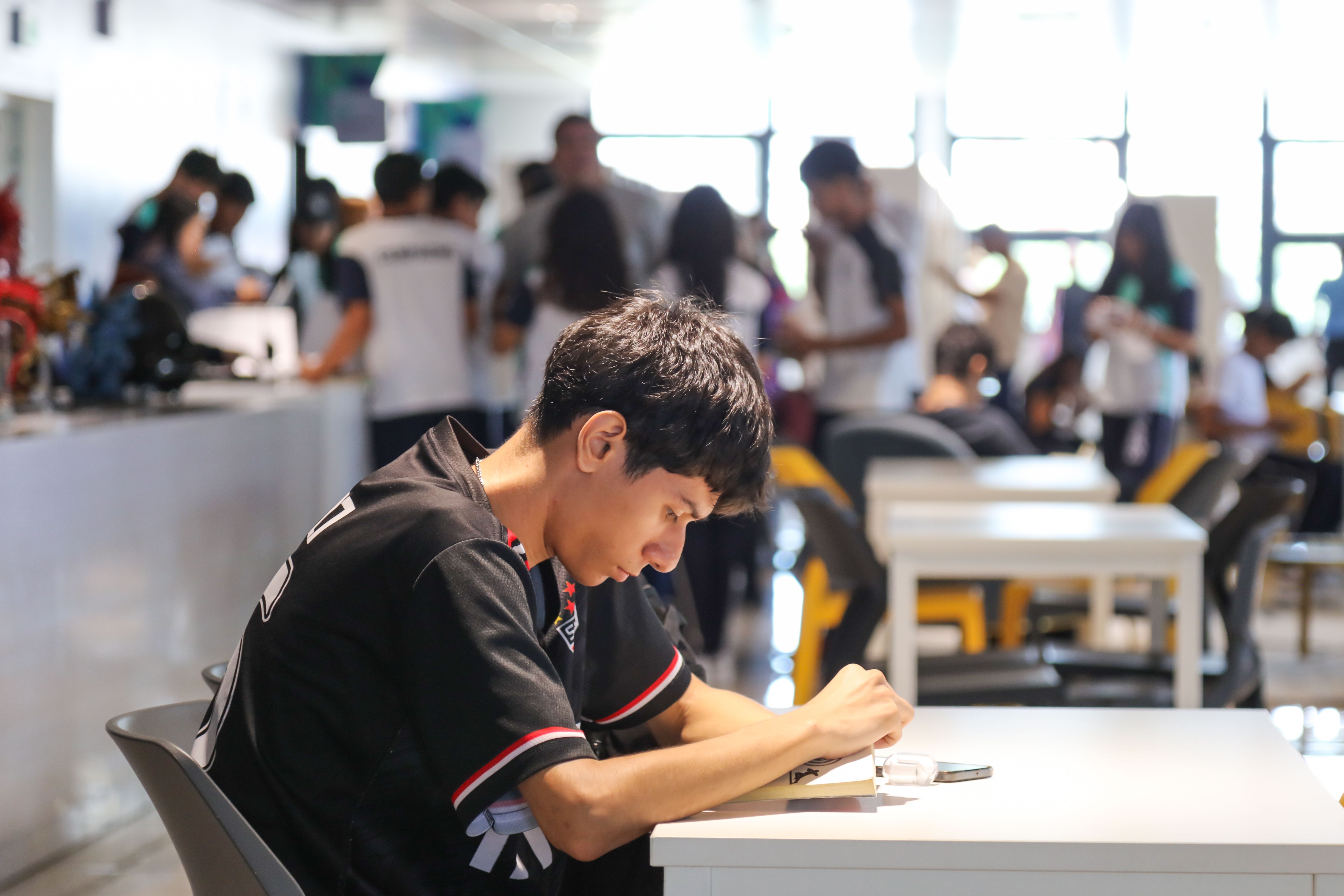  People read books between the shelves at the National Library of El Salvador.