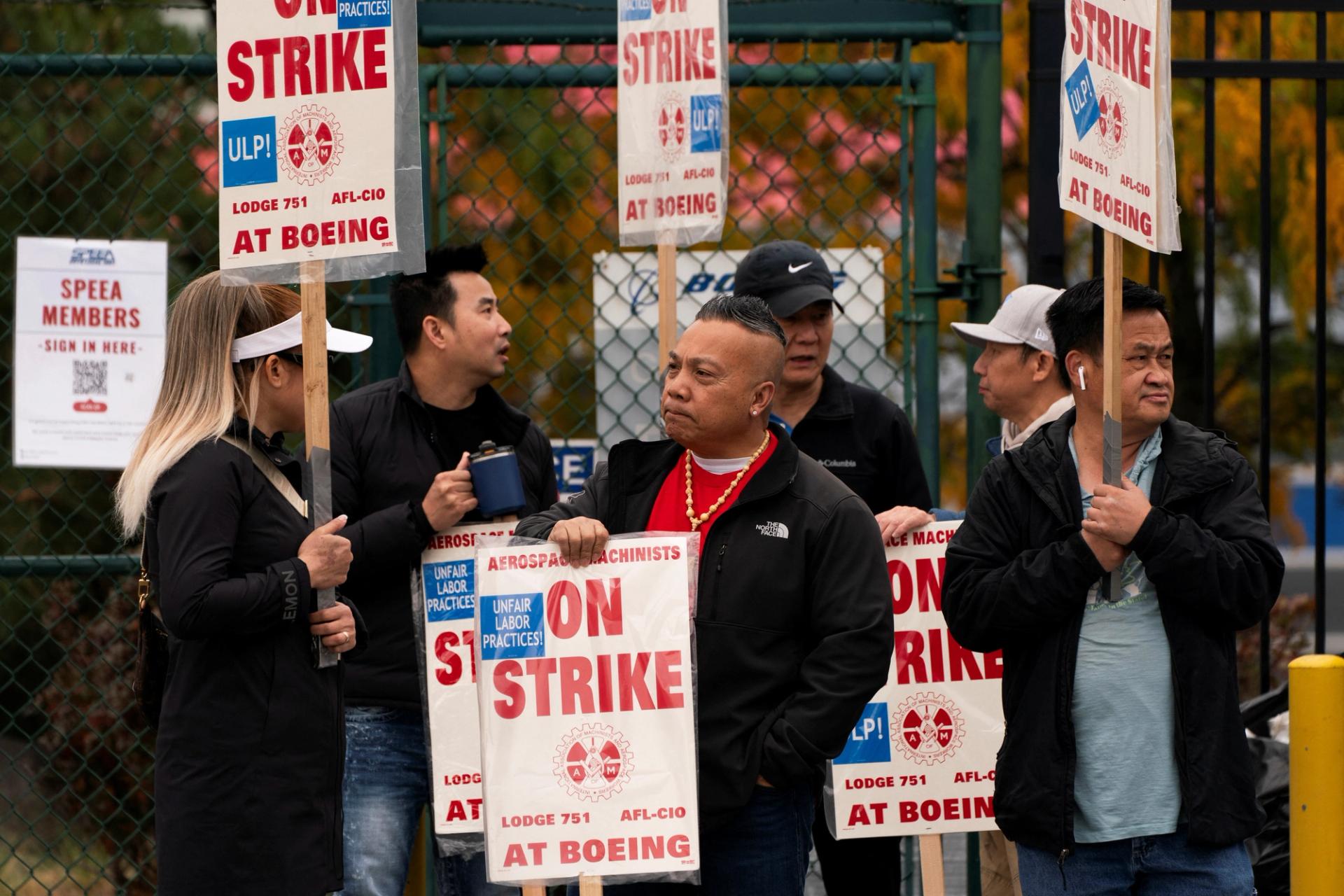 Boeing factory workers and supporters gather on a picket line near the entrance to a Boeing production facility in Renton, Washington