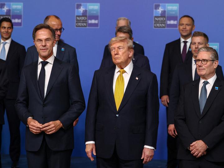 US President Donald Trump stands next to NATO Secretary General Mark Rutte and British Prime Minister Keir Starmer
