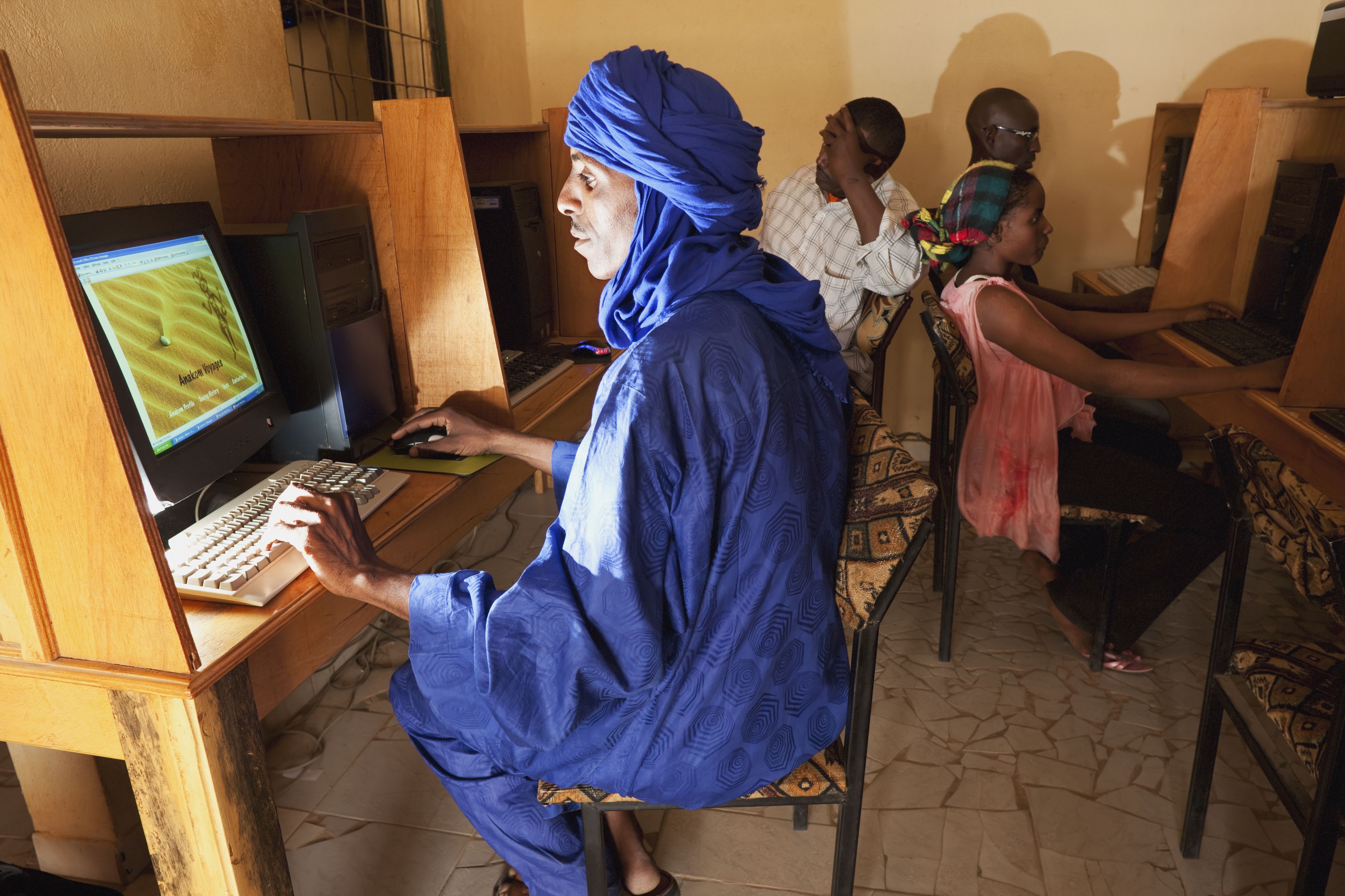 Tuareg man surfing the internet at a cafe in Niger. 