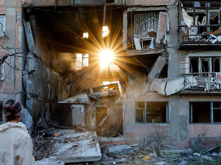 a heavily damaged multi-storey residential building following an overnight attack.