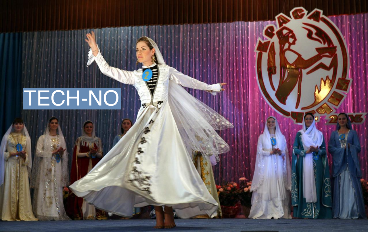 A Chechen woman in national costume dances during the Miss Chechnya beauty contest in Grozny May 27, 2006. 