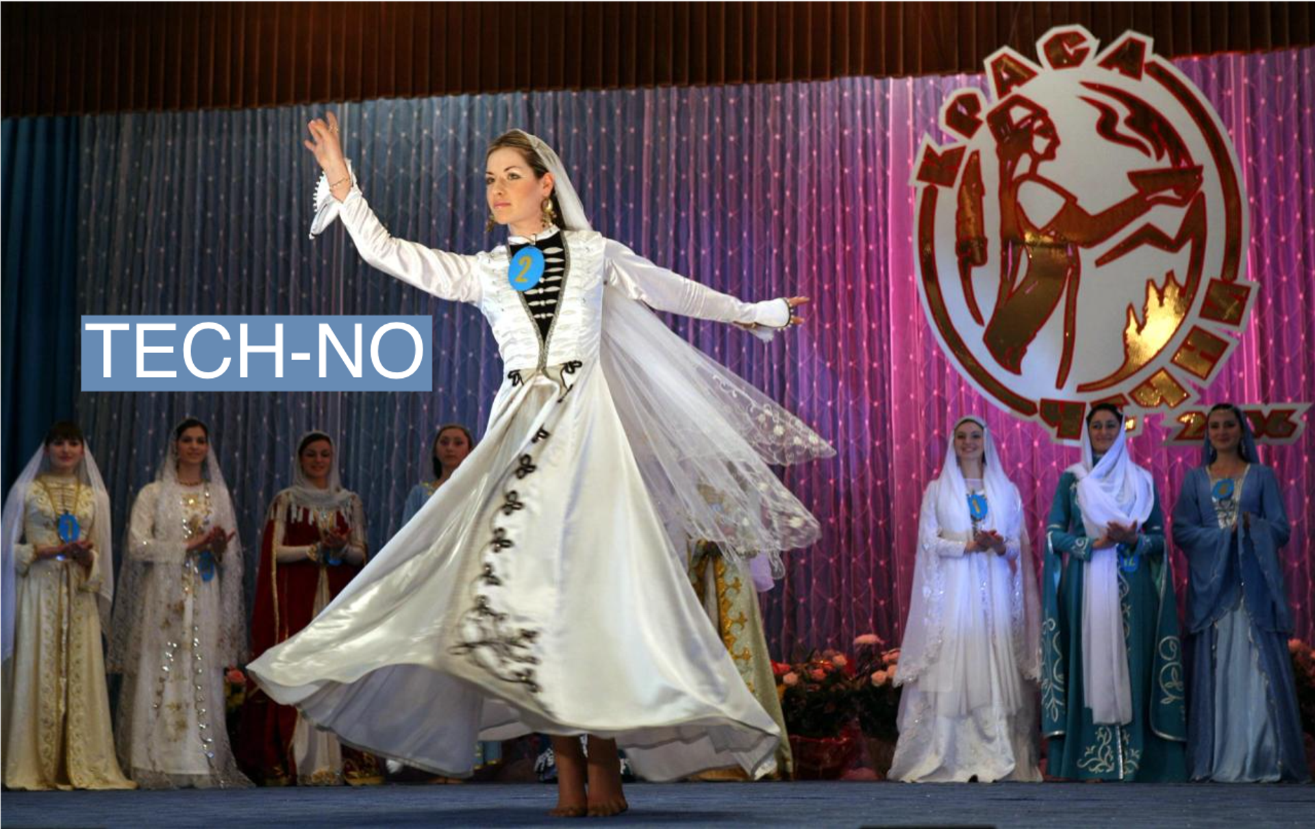 A Chechen woman in national costume dances during the Miss Chechnya beauty contest in Grozny May 27, 2006. 