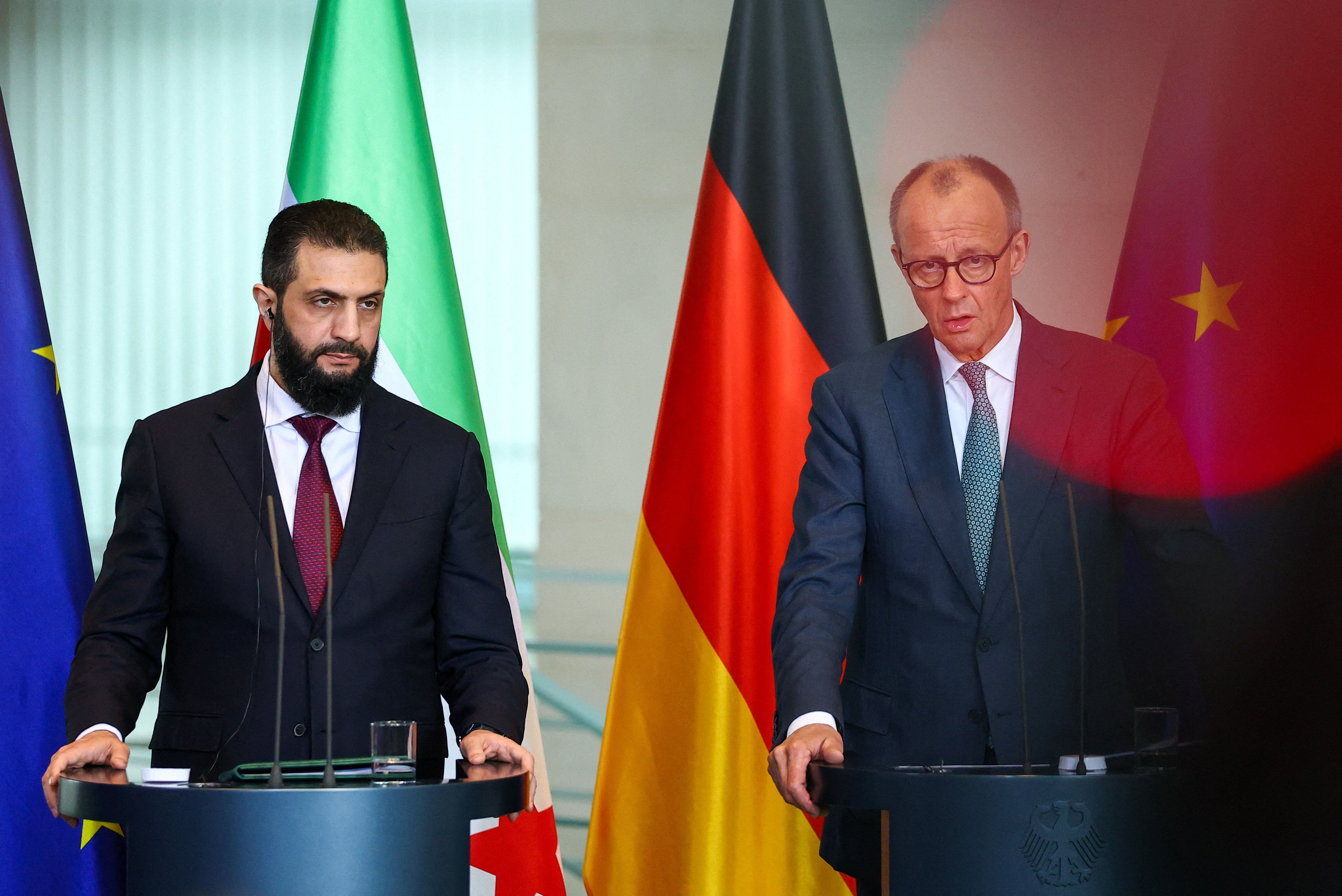 German Chancellor Friedrich Merz and Syrian President Ahmed al-Sharaa hold a press conference at the Chancellery, in Berlin.
