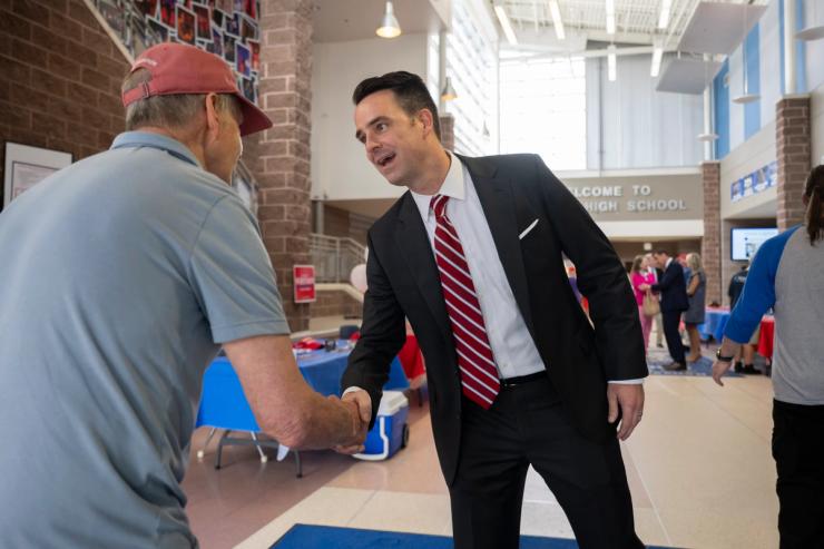 Stewart Whitson greets a voter